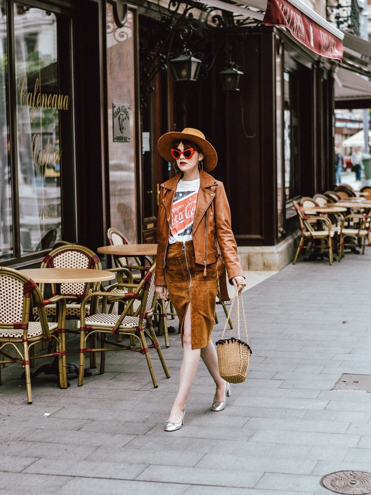 Budget friendly spring and summer outfit ideas 2017, Zara camel leather biker jacket, mango camel suede midi skirt, brown, zip front skirt, what to wear with a midi skirt, how to wear a midi skirt, neutral skirt, neutrals, topshop coca cola t-shirt, asos vintage coke tee, rivers island leather silver metallic pumps, block heel pumps, high heels, urban outfitters straw bag, woven bag, the best bag trend for summer, rafia bag, pom pom bag, biker jacket, camel fedora hat, wide brim hat, red cat eye sunglasses, retro sunglasses, vintage inspired, andreea birsan, couturezilla, parisian chic, silver hoop earrings, european fashion blogger, romanian fashion blog, fashionista, style inspiration, fashion trends for 2017, summer european street style inspiration 2017, what to wear on a chilly day, how to dress, chic outfit ideas for women, pinterest cute outfit for women, minimal outfits inspo, outffit of the day, ootd, how to wear neutrals, what to wear with camel, styling a midi skirt, tumblr girls photos, summer outfit ideas 2017