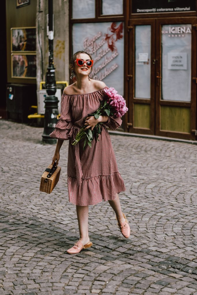 Zara red midi gingham dress, furry pink gucci mules, pink gucci loafers, blush pink, gucci slippers, slides, gucci lookalike shoes, dupes, asos square straw bag, topshop woven bag, river island summer bag, mango chic dress, ray ban retro cat eye red sunglasses, fresh peonies, flowers, blooms, pink peonies, jewelry, boohoo star earrings, andreea birsan, couturezilla, cute summer outfit ideas 2017, spring outfit inspiration, outfit inspo, ootd, outfit of the day, fashion trends for summer 2017, fashionista, european fashion blogger, romanian fashion blog, summer european street style, how to wear a midi gingham dress with slides, how to wear a midi dress, the best gingham dresses, gingham the hottest summer trend, messy bun, how to look parisian, italiana, parisian chic, cinematic, old center bucharest, summer in europe, chic lady, chic on a budget, feminine summer outfits, how to wear gingham like a pro, casual pinterest outfit for women, happy tumblr girls photos, pictures, urban decay red lipstick, summer style inspiration, how to wear red and pink, cuttest summer bags, the best bags for summer, tie bow dress, ruffle sleeves, frilled hem dress