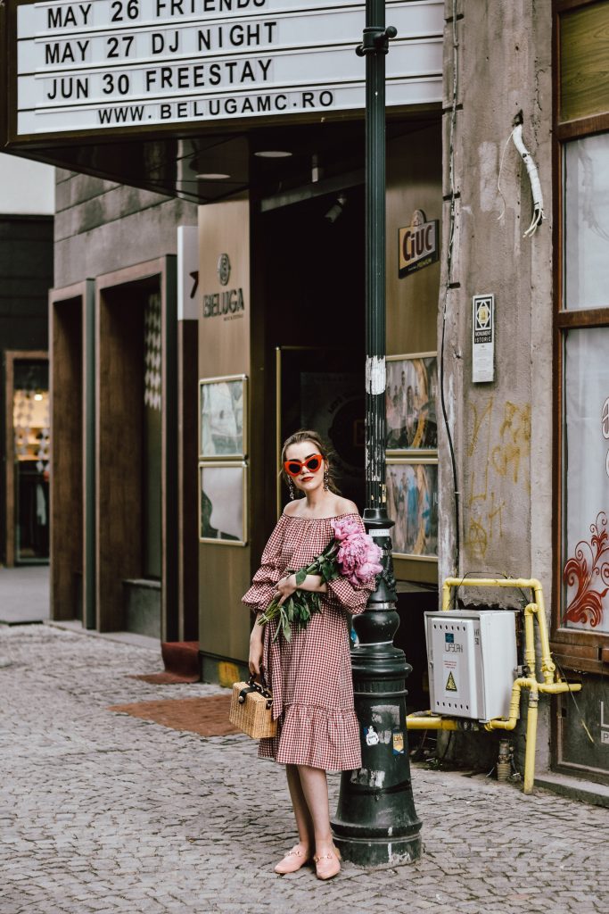 Zara red midi gingham dress, furry pink gucci mules, pink gucci loafers, blush pink, gucci slippers, slides, gucci lookalike shoes, dupes, asos square straw bag, topshop woven bag, river island summer bag, mango chic dress, ray ban retro cat eye red sunglasses, fresh peonies, flowers, blooms, pink peonies, jewelry, boohoo star earrings, andreea birsan, couturezilla, cute summer outfit ideas 2017, spring outfit inspiration, outfit inspo, ootd, outfit of the day, fashion trends for summer 2017, fashionista, european fashion blogger, romanian fashion blog, summer european street style, how to wear a midi gingham dress with slides, how to wear a midi dress, the best gingham dresses, gingham the hottest summer trend, messy bun, how to look parisian, italiana, parisian chic, cinematic, old center bucharest, summer in europe, chic lady, chic on a budget, feminine summer outfits, how to wear gingham like a pro, casual pinterest outfit for women, happy tumblr girls photos, pictures, urban decay red lipstick, summer style inspiration, how to wear red and pink, cuttest summer bags, the best bags for summer, tie bow dress, ruffle sleeves, frilled hem dress