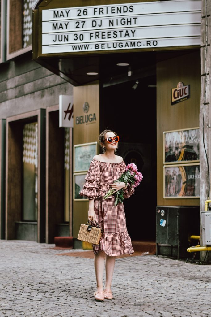 Zara red midi gingham dress, furry pink gucci mules, pink gucci loafers, blush pink, gucci slippers, slides, gucci lookalike shoes, dupes, asos square straw bag, topshop woven bag, river island summer bag, mango chic dress, ray ban retro cat eye red sunglasses, fresh peonies, flowers, blooms, pink peonies, jewelry, boohoo star earrings, andreea birsan, couturezilla, cute summer outfit ideas 2017, spring outfit inspiration, outfit inspo, ootd, outfit of the day, fashion trends for summer 2017, fashionista, european fashion blogger, romanian fashion blog, summer european street style, how to wear a midi gingham dress with slides, how to wear a midi dress, the best gingham dresses, gingham the hottest summer trend, messy bun, how to look parisian, italiana, parisian chic, cinematic, old center bucharest, summer in europe, chic lady, chic on a budget, feminine summer outfits, how to wear gingham like a pro, casual pinterest outfit for women, happy tumblr girls photos, pictures, urban decay red lipstick, summer style inspiration, how to wear red and pink, cuttest summer bags, the best bags for summer, tie bow dress, ruffle sleeves, frilled hem dress