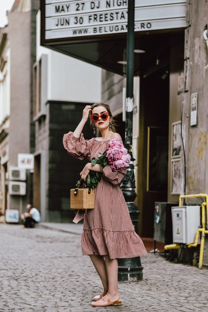 Zara red midi gingham dress, furry pink gucci mules, pink gucci loafers, blush pink, gucci slippers, slides, gucci lookalike shoes, dupes, asos square straw bag, topshop woven bag, river island summer bag, mango chic dress, ray ban retro cat eye red sunglasses, fresh peonies, flowers, blooms, pink peonies, jewelry, boohoo star earrings, andreea birsan, couturezilla, cute summer outfit ideas 2017, spring outfit inspiration, outfit inspo, ootd, outfit of the day, fashion trends for summer 2017, fashionista, european fashion blogger, romanian fashion blog, summer european street style, how to wear a midi gingham dress with slides, how to wear a midi dress, the best gingham dresses, gingham the hottest summer trend, messy bun, how to look parisian, italiana, parisian chic, cinematic, old center bucharest, summer in europe, chic lady, chic on a budget, feminine summer outfits, how to wear gingham like a pro, casual pinterest outfit for women, happy tumblr girls photos, pictures, urban decay red lipstick, summer style inspiration, how to wear red and pink, cuttest summer bags, the best bags for summer, tie bow dress, ruffle sleeves, frilled hem dress