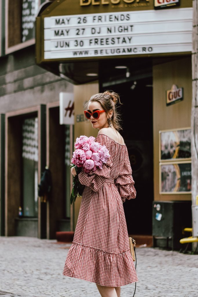 Zara red midi gingham dress, furry pink gucci mules, pink gucci loafers, blush pink, gucci slippers, slides, gucci lookalike shoes, dupes, asos square straw bag, topshop woven bag, river island summer bag, mango chic dress, ray ban retro cat eye red sunglasses, fresh peonies, flowers, blooms, pink peonies, jewelry, boohoo star earrings, andreea birsan, couturezilla, cute summer outfit ideas 2017, spring outfit inspiration, outfit inspo, ootd, outfit of the day, fashion trends for summer 2017, fashionista, european fashion blogger, romanian fashion blog, summer european street style, how to wear a midi gingham dress with slides, how to wear a midi dress, the best gingham dresses, gingham the hottest summer trend, messy bun, how to look parisian, italiana, parisian chic, cinematic, old center bucharest, summer in europe, chic lady, chic on a budget, feminine summer outfits, how to wear gingham like a pro, casual pinterest outfit for women, happy tumblr girls photos, pictures, urban decay red lipstick, summer style inspiration, how to wear red and pink, cuttest summer bags, the best bags for summer, tie bow dress, ruffle sleeves, frilled hem dress