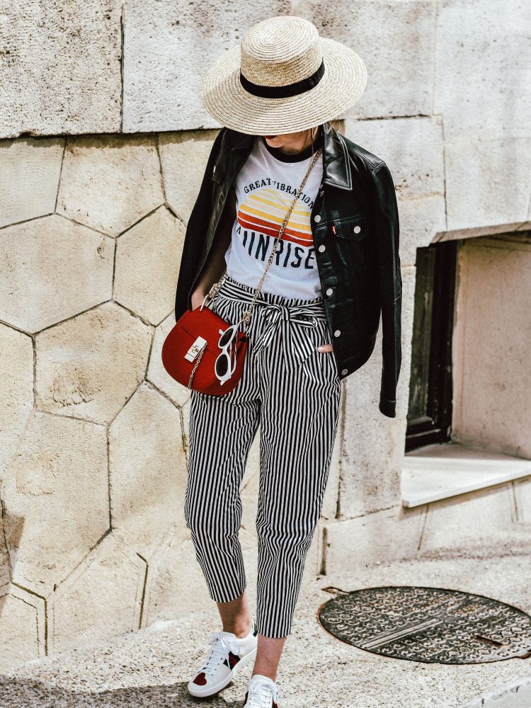 Budget friendly spring and summer outfit ideas 2017, Zara paperbag striped pants with tie bow in front, mango retro graphic tee, asos printed tee, t-shirt, ace gucci sneakers, white leather sneakers, gucci sneakers with hearts, white kicks, chloe drew red crossbody bag, chloe drew lookalike bag, topshop straw hat, levis leather trucker jacket, genuine leather jacket, button down, silver hoop earrings, messy hair, bun, red lipstick, rivers island white sunglasses, retro sunglasses, sunnies, andreea birsan, couturezilla, cute spring outfit ideas for women 2017, how to wear striped pants, stripe trousers, what to wear stripe pants with, cute tumblr girls, the best outfit ideas for spring and summer, fashionista, fashion inspiration, european spring street style, romanian fashion blog, european fashion blogger, casual off duty style, chic on a budget, minimal outfits for women, ootd, outfit of the day, fashion trends for 2017, style inspiration, inspo, classy, casual pinterest outfit for women, what i wore, how to dress when you're uninspired