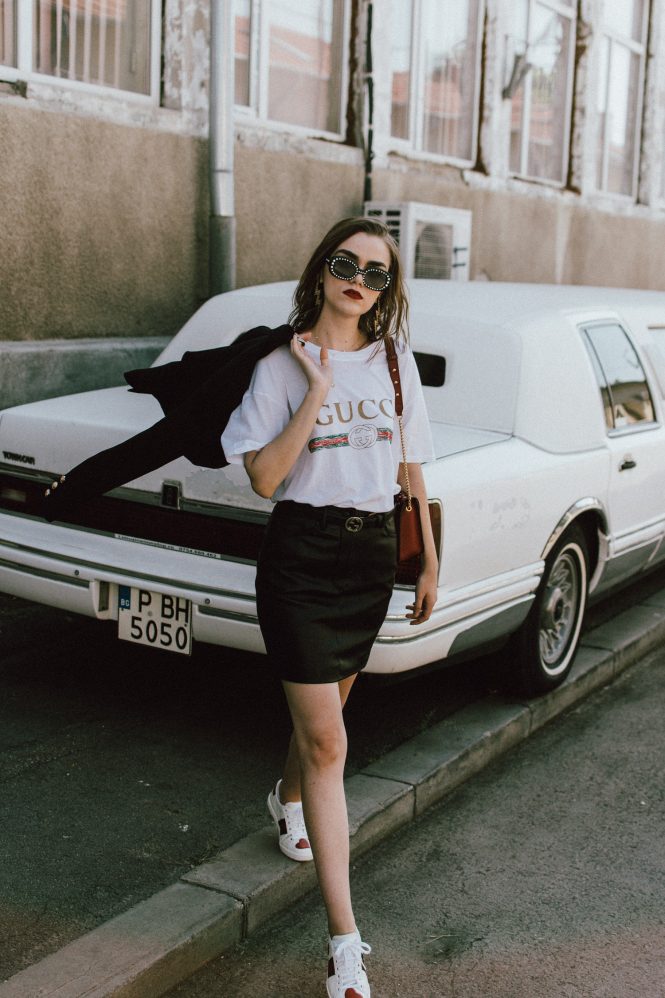 Gucci t-shirt, mango mini skirt, zara blazer, furla ruby red leather lace metropolis shoulder bag, gucci ace heart embroidered sneakers, asos sunglasses, andreea birsan, couturezilla, transitional cute summer outfit ideas 2017, transitional dressing, transitional outfit, gucci logo tee for women, zara a line black leather mini skirt, statement sneakers with hearts, white leather sneakers, choker necklace with stars, gold accessories, square 90s sunglasses, vintage looking sunglasses, double breasted golden buttons black tailored blazer, transitional blazer, the popular gucci t-shirt from instagram, the best blazer for autumn, fall dressing, fall outfit, back to school ootd, too cool for school, statement earrings with thunderbolt, h&m earrings, red lipstick, ombre medium length hair, how to wear a mini skirt and not look like a teenager, mini skirt, black leather mini skirt, tube skirt, mvn blazer, the cute gucci sneakers, how to look Parisian chic, European summer street style inspiration for women 2017, pinterest chic outfit ideas for woman, summer outfit ideas, summer ootd inspiration, outfit of the day, ootd, fashion icon, style inspiration, fashionista, fashion inspiration, style inspo, what to wear in summer, how to look French, chic on a budget, zara outfit, mango, topshop, asos, river island, forever 21, urban outfitters, how to mix high end pieces with luxury ones, zara and Gucci, how to look chic when not wearing a dress, outfit alternatives for summer, tomboy chic, minimal outfit, tumblr girls photos, pictures, happy girl, women, smart casual outfits, the best outfit ideas 2017, what to wear when you don’t feel inspired, summer in Europe, weekend attire, uniform, French women in summer, European outfit ideas 2017, minimal chic outfit, how to stand out, the best outfit ideas for summer, the sunglasses you have seen everywhere on Instagram, glasses, uk fashion blogger, united kingdom, uk fashion blog, fashion and travel blog, Europe, women with style, street style, summer fashion trends 2017, best fashion ideas, styling