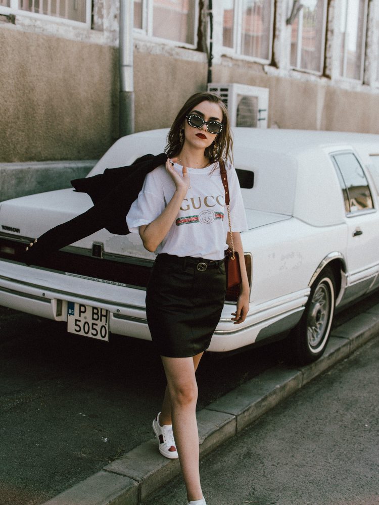 Gucci t-shirt, mango mini skirt, zara blazer, furla ruby red leather lace metropolis shoulder bag, gucci ace heart embroidered sneakers, asos sunglasses, andreea birsan, couturezilla, transitional cute summer outfit ideas 2017, transitional dressing, transitional outfit, gucci logo tee for women, zara a line black leather mini skirt, statement sneakers with hearts, white leather sneakers, choker necklace with stars, gold accessories, square 90s sunglasses, vintage looking sunglasses, double breasted golden buttons black tailored blazer, transitional blazer, the popular gucci t-shirt from instagram, the best blazer for autumn, fall dressing, fall outfit, back to school ootd, too cool for school, statement earrings with thunderbolt, h&m earrings, red lipstick, ombre medium length hair, how to wear a mini skirt and not look like a teenager, mini skirt, black leather mini skirt, tube skirt, mvn blazer, the cute gucci sneakers, how to look Parisian chic, European summer street style inspiration for women 2017, pinterest chic outfit ideas for woman, summer outfit ideas, summer ootd inspiration, outfit of the day, ootd, fashion icon, style inspiration, fashionista, fashion inspiration, style inspo, what to wear in summer, how to look French, chic on a budget, zara outfit, mango, topshop, asos, river island, forever 21, urban outfitters, how to mix high end pieces with luxury ones, zara and Gucci, how to look chic when not wearing a dress, outfit alternatives for summer, tomboy chic, minimal outfit, tumblr girls photos, pictures, happy girl, women, smart casual outfits, the best outfit ideas 2017, what to wear when you don’t feel inspired, summer in Europe, weekend attire, uniform, French women in summer, European outfit ideas 2017, minimal chic outfit, how to stand out, the best outfit ideas for summer, the sunglasses you have seen everywhere on Instagram, glasses, uk fashion blogger, united kingdom, uk fashion blog, fashion and travel blog, Europe, women with style, street style, summer fashion trends 2017, best fashion ideas, styling