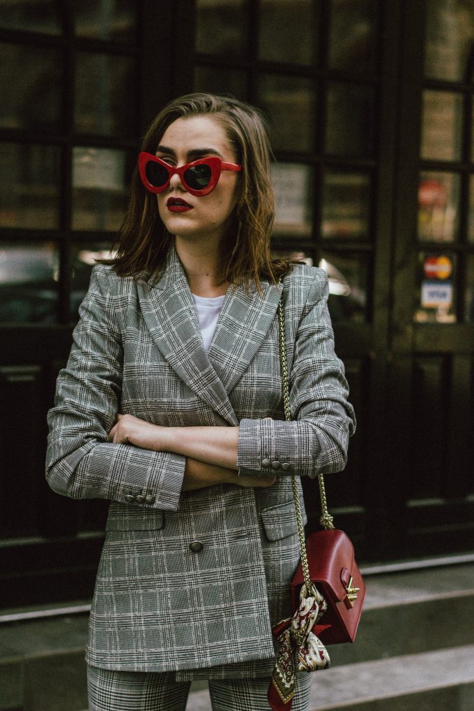 Zara check printed suit, mango check printed blazer,topshop checked flared trousers, checked suit, cropped trousers, gucci white ace heart embroidered sneakers, furla metropolis red bag, coke tee, coca cola t-shirt, andreea birsan, couturezilla, cute fall outfit ideas 2017, check suit, edgy outfit for women, silk scarf, red retro sunglasses, big sunglasses, tomboy chic outfit, how to style a suit, what to wear with a women suit, how to make a suit look casual chic, how to make an outfit look edgy, how to wear a suit with sneakers, sneakers and suits, white shoes, white leather sneakers, statement sneakers, lips printed earrings, statement earrings, red cat eye sunglasses, sunnies, fall outfit ideas for women 2017, transitional outfit ideas, transitional ootd, transitioning into autumn, autumn 2017, moody photoshoot, how to look Parisian chic, European summer street style inspiration for women 2017, pinterest chic outfit ideas for woman, summer outfit ideas, summer ootd inspiration, outfit of the day, ootd, fashion icon, style inspiration, fashionista, fashion inspiration, style inspo, what to wear in summer, how to look French, chic on a budget, zara outfit, mango, topshop, asos, river island, forever 21, urban outfitters, how to mix high end pieces with luxury ones, zara and Gucci,outfit alternatives for summer, tomboy chic, minimal outfit, tumblr girls photos, pictures, happy girl, women, smart casual outfits, the best outfit ideas 2017, what to wear when you don’t feel inspired, summer in Europe, weekend attire, uniform, French women in summer, European outfit ideas 2017, minimal chic outfit, how to stand out, the best outfit ideas for summer, the sunglasses you have seen everywhere on Instagram, glasses, uk fashion blogger, united kingdom, uk fashion blog, fashion and travel blog, Europe, women with style, street style, summer fashion trends 2017, best fashion ideas, styling, fall in europe