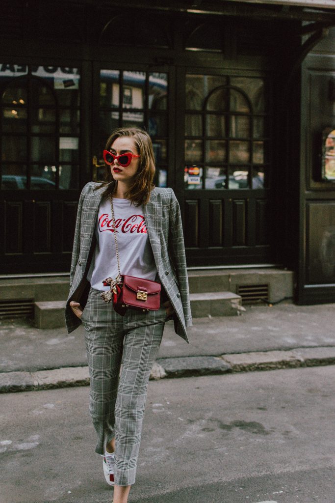 Zara check printed suit, mango check printed blazer,topshop checked flared trousers, checked suit, cropped trousers, gucci white ace heart embroidered sneakers, furla metropolis red bag, coke tee, coca cola t-shirt, andreea birsan, couturezilla, cute fall outfit ideas 2017, check suit, edgy outfit for women, silk scarf, red retro sunglasses, big sunglasses, tomboy chic outfit, how to style a suit, what to wear with a women suit, how to make a suit look casual chic, how to make an outfit look edgy, how to wear a suit with sneakers, sneakers and suits, white shoes, white leather sneakers, statement sneakers, lips printed earrings, statement earrings, red cat eye sunglasses, sunnies, fall outfit ideas for women 2017, transitional outfit ideas, transitional ootd, transitioning into autumn, autumn 2017, moody photoshoot, how to look Parisian chic, European summer street style inspiration for women 2017, pinterest chic outfit ideas for woman, summer outfit ideas, summer ootd inspiration, outfit of the day, ootd, fashion icon, style inspiration, fashionista, fashion inspiration, style inspo, what to wear in summer, how to look French, chic on a budget, zara outfit, mango, topshop, asos, river island, forever 21, urban outfitters, how to mix high end pieces with luxury ones, zara and Gucci,outfit alternatives for summer, tomboy chic, minimal outfit, tumblr girls photos, pictures, happy girl, women, smart casual outfits, the best outfit ideas 2017, what to wear when you don’t feel inspired, summer in Europe, weekend attire, uniform, French women in summer, European outfit ideas 2017, minimal chic outfit, how to stand out, the best outfit ideas for summer, the sunglasses you have seen everywhere on Instagram, glasses, uk fashion blogger, united kingdom, uk fashion blog, fashion and travel blog, Europe, women with style, street style, summer fashion trends 2017, best fashion ideas, styling, fall in europe