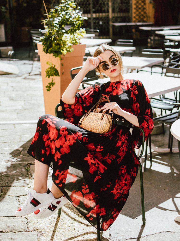 Pleated midi floral dress, gucci ace sneakers, straw bag, sunglasses, andreea birsan, couturezilla, cute summer outfit 2017, h&m midi floral dress, black and red dress, how to wear a midi dresss with sneakers, gucci ace heart embroidered sneakers, dress and gucci sneakers, heart embroidered white sneakers, where to find the best sneakers, woven bag, raffia bag, basket bag, straw bag, mini bag for summer, round ray ban lookalike sunglasses, wide belt, what to wear on a summer eurotrip, black friday deals, how to look Parisian chic, European summer street style inspiration for women 2017, pinterest chic outfit ideas for woman, summer outfit ideas, summer ootd inspiration, outfit of the day, ootd, fashion icon, style inspiration, fashionista, fashion inspiration, style inspo, what to wear in summer, how to look French, chic on a budget, zara outfit, mango, topshop, asos, river island, forever 21, urban outfitters, how to mix high end pieces with luxury ones, zara and Gucci,outfit alternatives for summer, tomboy chic, minimal outfit, tumblr girls photos, pictures, happy girl, women, smart casual outfits, the best outfit ideas 2017, what to wear when you don’t feel inspired, summer in Europe, weekend attire, uniform, French women in summer, European outfit ideas 2017, minimal chic outfit, how to stand out, the best outfit ideas for summer, the sunglasses you have seen everywhere on Instagram, glasses, uk fashion blogger, united kingdom, uk fashion blog, fashion and travel blog, Europe, women with style, street style, summer fashion trends 2017, best fashion ideas, styling, fall fashion, fall outfit, fall ootd, fall perfect, transitional dressing, best transitional outfit ideas, how to wear statement earrings, dressing for autumn, autumn outfit, nyfw, lfw, fashion week, pfw, couturezilla andreea birsan at paris fashion week 2017, pfw 2017, paris fashion week street style andreea birsan couturezilla