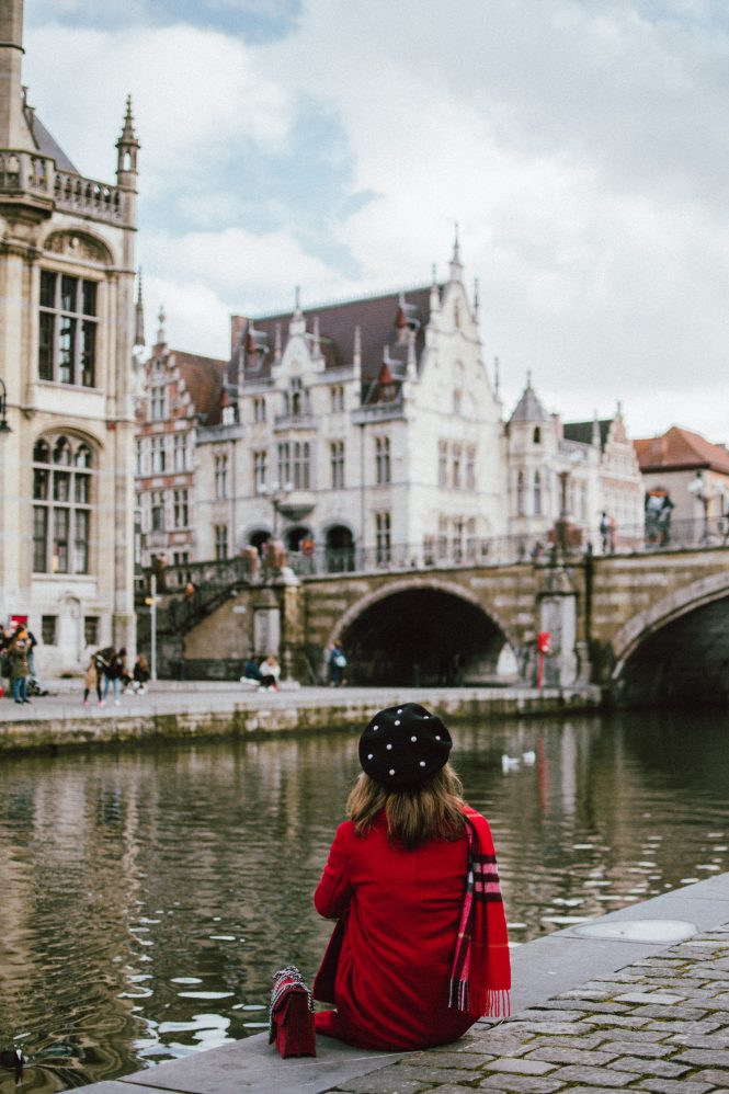 How to spend 24 hours in Ghent, Belgium, travel guide, one day in ghent belgium, andreea birsan, couturezilla, gent, red long coat, pearl embellished black beret, red burberry scarf, cute winter outfit 2018, what to do in ghent, plaid scarf, over the knee boots, otk boots, faux suede over the knee boots, heeled otk boots, black winter boots, how to wear over the knee boots, rhinestone fishnet tights, stockings, how to wear fishnets, real suede mini skirt, button up skirt in black, striped top, stripes and plaid, how to mix prints, where to go in ghent, black cat eye sunglasses, how to wear red like a pro, how to look Parisian chic, European summer street style inspiration for women 2017, pinterest chic outfit ideas for woman, summer outfit ideas, summer ootd inspiration, outfit of the day, ootd, fashion icon, style inspiration, fashionista, fashion inspiration, style inspo, what to wear in summer, how to look French, chic on a budget, zara outfit, mango, topshop, asos, river island, forever 21, urban outfitters, how to mix high end pieces with luxury ones, zara and Gucci,outfit alternatives for summer, tomboy chic, minimal outfit, tumblr girls photos, pictures, happy girl, women, smart casual outfits, the best outfit ideas 2017, what to wear when you don’t feel inspired, summer in Europe, weekend attire, uniform, French women in summer, European outfit ideas 2017, minimal chic outfit, how to stand out, the best outfit ideas for summer, the sunglasses you have seen everywhere on Instagram, glasses, uk fashion blogger, united kingdom, uk fashion blog, fashion and travel blog, Europe, women with style, street style, summer fashion trends 2017, best fashion ideas, styling, fall fashion, fall outfit, fall ootd, fall perfect, transitional dressing, best transitional outfit ideas, how to wear statement earrings, dressing for autumn, autumn outfit, winter outfit ideas for work and school 2017