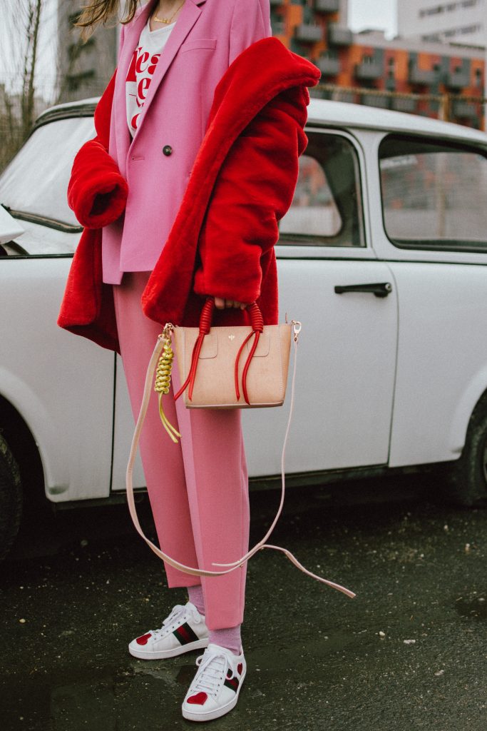 Pink high waisted peg trousers, blush pink pants, trousers with high waist and big belt, the cute pink trousers from zara, topshop tailored pink blazer, dusty pink jacket, how to wear a pink suit like a pro, graphic t-shirt, fearless girl, statement leather two tone bag, cute mini bag, micro bag trend, isla fontaine bag, pink tinted aviator sunglasses, gucci ace hear embroidered white sneakers, gucci ace shoes, gucci ace white sneakers with hearts, leather white sneakers, genuine leather, boohoo red faux fur coat, andreea birsan, couturezilla, cute winter outfit ideas for 2018, how to wear faux fur coats and jackets, the teddy bear coats trend, how to wear red and pink, pink and red outfit for winter, suit up in winter, winter suit outfit ideas for women 2018, pink glitter socks with unicorns, how to wear a suit with sneakers, 2018 fresh casual ideas, american style, andreea birsan street styles, asos, casual off duty style, couturezilla, cute and casual outfits for spring 2018, european fashion blogger, fashion inspiration, fashion inspo, fashionista, how to dress like a parisian, how to look parisian chic, how to make minimal outfits stand out, mango, minimal outfits for spring, modern minimalism, ootd, outfit of the day, pinterest outfit for women, red cat eye sunglasses, red lipstick, romanian fashion blog, romanian fashion blogger, silk scarf, spring fashion trends for 2018, spring outfit inspiration 2018, spring outfits for women, spring street style 2018, topshop, tumblr girls outfit, women with style, zara, uk blogger, fall dressing, transitional outfits, autumn ootd, autumn outfit, fall fashion, winter outfit ideas 2018, cute winter ootd, winter outfit ideas for work and school, street style 2018, sex and the city necklace, name necklace, heart shaped hoop earrings, fast fashion mixed with luxury items