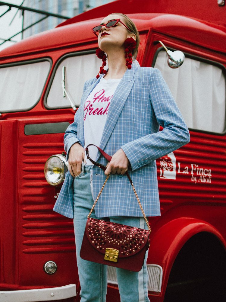 Baby blue checked blazer, statement jeans, furla metropolis red bag, small sunglasses, tee, andreea birsan, couturezilla, cute spring outfit ideas 2018, baby blue blazre, how to wear pastels this spring, jeans with constrastic side panel, redone jeans, reconstructed jeans trend, how to wear reconstructed jeans, red pom pom statement earrings, small cat eye sunglasses in red, retro small sunglasses, small sunnies, matrix sunglasses trend, micro sunglasses trend, red earrings, red and baby blue outfit, how to wear the white shoes trend, white leather high heels, white chuncky heel shoes, white pumps, heart breaker t-shirt, printed tshirt, printed tee, graphic t-shirt, furla red lace cut out metropolis bag, furla leather shoulder bag, furla red metropolis, furla large metropolis bag in red, how to style a furla bag, perfect spring outfit for work and hanging out, red food van, how to look Parisian chic, European summer street style inspiration for women 2017, pinterest chic outfit ideas for woman, summer outfit ideas, summer ootd inspiration, outfit of the day, ootd, fashion icon, style inspiration, fashionista, fashion inspiration, style inspo, what to wear in summer, how to look French, chic on a budget, zara outfit, mango, topshop, asos, river island, forever 21, urban outfitters, how to mix high end pieces with luxury ones, zara and Gucci,outfit alternatives for summer, tomboy chic, minimal outfit, tumblr girls photos, pictures, happy girl, women, smart casual outfits, the best outfit ideas 2017, what to wear when you don’t feel inspired, summer in Europe, weekend attire, uniform, French women in summer, European outfit ideas 2017, minimal chic outfit, how to stand out, the best outfit ideas for summer, the sunglasses you have seen everywhere on Instagram, glasses, uk fashion blogger, united kingdom, uk fashion blog, fashion and travel blog, Europe, women with style, street style, summer fashion trends 2017, best fashion ideas, styling, fall fashion, fall outfit, fall ootd, fall perfect, transitional dressing, best transitional outfit ideas, how to wear statement earrings, dressing for autumn, autumn outfit, winter outfit ideas for work and school 2017