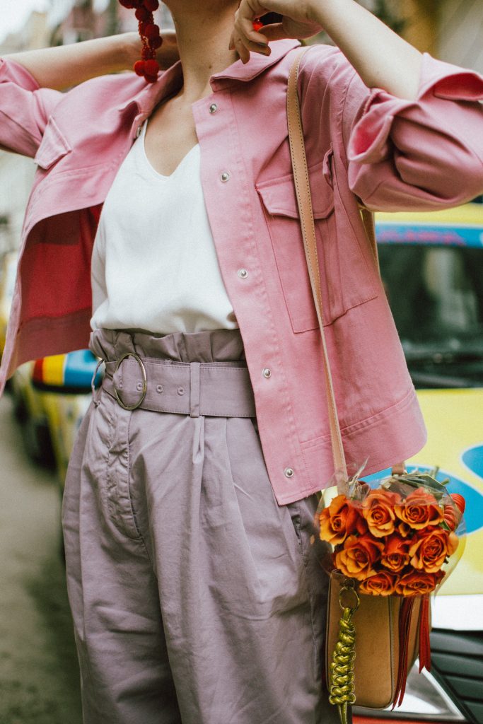 Pastels, pink denim jacket, purple trousers, white shoes, statement earrings, andreea birsan, couturezilla, cute spring outfit ideas 2018, pink and purple spring outfit ideas for 2018, pink cropped cotton jacket, pink trucker jacket, cropped pink denim jacket from na-kd, nakd jacket, mango white camisole top, cami tank top, basic white cami, how to wear a white cami top, how to wear pastels this spring, the pastels fashion trend, head to toe pastels, statement bag, multicolor bag, mini bag, micro tote bag, dusty pink bag, blush pink bag, red statement earrings, earrings with pom poms, xxl earrings, aviator clear lens glasses, the instagram clear lens glasses trend, purple high waisted peg trousers, the best mango trousers, linen and cotton, white leather pumps with block heel, white leather shoes, the white shoes trend, liliac, violet trousers, liliac pants, pastel pants, peg trousers, high waisted trousers with belt detail, how to look Parisian chic, European summer street style inspiration for women 2017, pinterest chic outfit ideas for woman, summer outfit ideas, summer ootd inspiration, outfit of the day, ootd, fashion icon, style inspiration, fashionista, fashion inspiration, style inspo, what to wear in summer, how to look French, chic on a budget, zara outfit, mango, topshop, asos, river island, forever 21, urban outfitters, how to mix high end pieces with luxury ones, zara and Gucci,outfit alternatives for summer, tomboy chic, minimal outfit, tumblr girls photos, pictures, happy girl, women, smart casual outfits, the best outfit ideas 2017, what to wear when you don’t feel inspired, summer in Europe, weekend attire, uniform, French women in summer, European outfit ideas 2017, minimal chic outfit, how to stand out, the best outfit ideas for summer, the sunglasses you have seen everywhere on Instagram, glasses, uk fashion blogger, united kingdom, uk fashion blog, fashion and travel blog, Europe, women with style, street style, summer fashion trends 2017, best fashion ideas, styling, fall fashion, fall outfit, fall ootd, fall perfect, transitional dressing, best transitional outfit ideas, how to wear statement earrings, dressing for autumn, autumn outfit, winter outfit ideas for work and school 2017