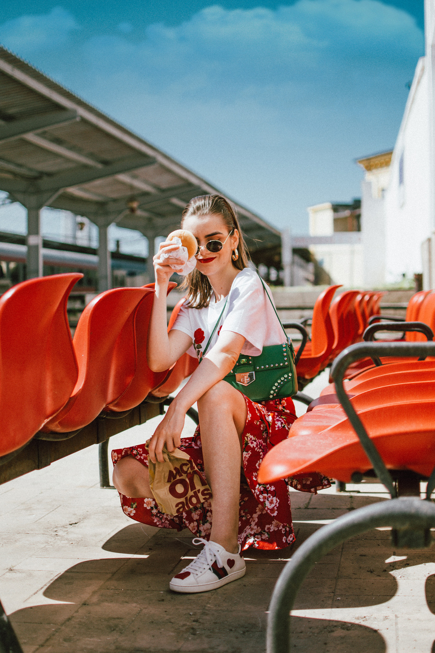 NA-KD asymmetric floral print skirt, rose patch t-shirt, gucci heart sneakers, prada green bag, andreea birsan, couturezilla, cute spring outfit ideas 2018, cherry blossom skirt, midi skirt with double frills, red midi skirt with double frill and floral print, sakura print midi skirt, feminine skirt, how to temper a feminine look, rose patch white t-shirt from nakd, the popular rose boobs t-shirt, how to mix floral prints, gucci ace heart embroidered white sneakers, red midi skirt, red and white outfit, gucci sneakers, gucci leather sneakers, white trainers, how to wear a skirt with sneakers, green prada bag with studs and stones, green shoulder bag, h&m oval sunglasses, oval sunglasses, micro sunglasses trend, how to wear a midi skirt, what shoes to wear with a midi skirt, how to wear an asymmetric skirt, asymmetrical skirt, sakura, floral print midi skirt, flower print, red, red skirt, what color to wear with red, red and green, gold hoop earrings, skirt and sneakers, how to look Parisian chic, European summer street style inspiration for women 2017, pinterest chic outfit ideas for woman, summer outfit ideas, summer ootd inspiration, outfit of the day, ootd, fashion icon, style inspiration, fashionista, fashion inspiration, style inspo, what to wear in summer, how to look French, chic on a budget, zara outfit, mango, topshop, asos, river island, forever 21, urban outfitters, how to mix high end pieces with luxury ones, zara and Gucci,outfit alternatives for summer, tomboy chic, minimal outfit, tumblr girls photos, pictures, happy girl, women, smart casual outfits, the best outfit ideas 2017, what to wear when you don’t feel inspired, summer in Europe, weekend attire, uniform, French women in summer, European outfit ideas 2017, minimal chic outfit, how to stand out, the best outfit ideas for summer, the sunglasses you have seen everywhere on Instagram, glasses, uk fashion blogger, united kingdom, uk fashion blog, fashion and travel blog, Europe, women with style, street style, summer fashion trends 2017, best fashion ideas, styling, fall fashion, fall outfit, fall ootd, fall perfect, transitional dressing, best transitional outfit ideas, how to wear statement earrings, dressing for autumn, autumn outfit, winter outfit ideas for work and school 2017