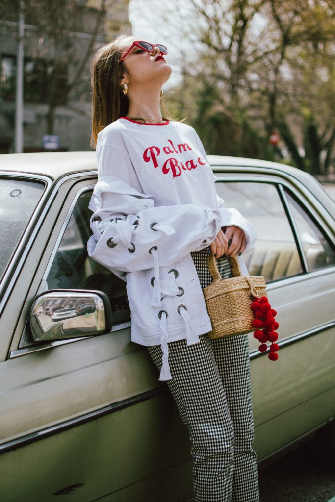 Spring basics, Zara gingham trousers, graphit tee, oversize white jacket with lace up, red shoes, straw bag, andreea birsan, couturezilla, cute spring outfit ideas 2018, high waist check trousers, checkered pants, vichy trousers, black and white trousers, check printed trousers, retro pants, printed t-shirt with message, red cat eye sunglasses, layered gold necklaces, gold hoop earrings, straw bag, raffia bag, the cutest bag for spring and summer, the straw bag trend, where to find the best straw bat, straw bag with red pom pom, red pompom, red accessories, black white and red spring outfit ideas, rattan bag, wicker bag, basket bag for spring and summer, white denim jacket, oversized jacket, oversize white denim jacket with lace out details, denim jacket with a twist, red leather shoes with fun heel, block heel red shoes, red leather, how to look Parisian chic, European summer street style inspiration for women 2017, pinterest chic outfit ideas for woman, summer outfit ideas, summer ootd inspiration, outfit of the day, ootd, fashion icon, style inspiration, fashionista, fashion inspiration, style inspo, what to wear in summer, how to look French, chic on a budget, zara outfit, mango, topshop, asos, river island, forever 21, urban outfitters, how to mix high end pieces with luxury ones, zara and Gucci,outfit alternatives for summer, tomboy chic, minimal outfit, tumblr girls photos, pictures, happy girl, women, smart casual outfits, the best outfit ideas 2017, what to wear when you don’t feel inspired, summer in Europe, weekend attire, uniform, French women in summer, European outfit ideas 2017, minimal chic outfit, how to stand out, the best outfit ideas for summer, the sunglasses you have seen everywhere on Instagram, glasses, uk fashion blogger, united kingdom, uk fashion blog, fashion and travel blog, Europe, women with style, street style, summer fashion trends 2017, best fashion ideas, styling, fall fashion, fall outfit, fall ootd, fall perfect, transitional dressing, best transitional outfit ideas, how to wear statement earrings, dressing for autumn, autumn outfit, winter outfit ideas for work and school 2017