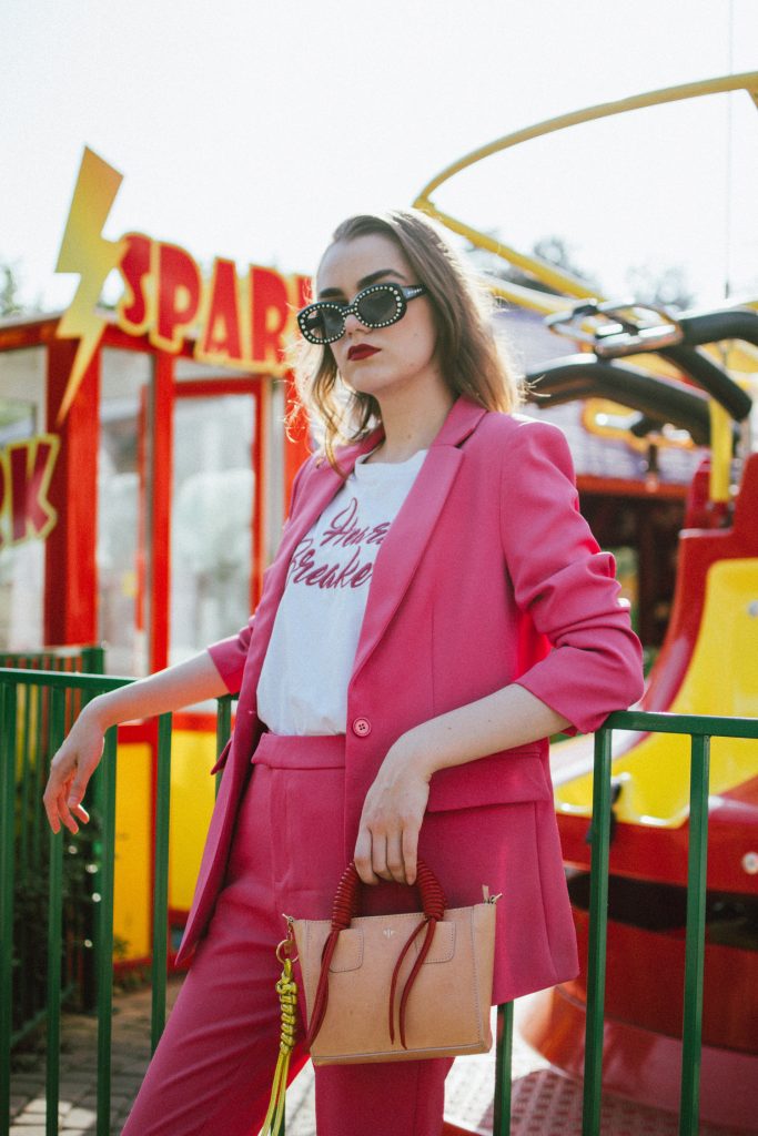 Zara pink suit, blazer, trousers, gucci pink loafers, t-shirt, mini bag, andreea birsan, couturezilla, cute spring outfit ideas 2018, pink blazer, pink trousers, pink suit co-ord, how to wear a pink suit, all pink outfit, na-kd outfit, na-kd promo code,nakd suit, how to wear pink like a pro, heart breaker t-shirt, white t-shirt, printed t-shirt, mango white t-shirt, the best white tees, gucci horsebit pink patent loafers, gucci classic pink loafers, gucci pink leather loafers, horsebit loafers, timeless loafers, colorblock leather mini bag, isla fontaine mini tote bag, square 90s rhinestone sunglasses, gucci inspired sunglasses, minnie mouse, photo shoot in the park, what to wear with a pink suit, what shoes to wear with a women’s suit, office ready outfit, perfect work outfit, beach waves, pink suit, how to look Parisian chic, European summer street style inspiration for women 2017, pinterest chic outfit ideas for woman, summer outfit ideas, summer ootd inspiration, outfit of the day, ootd, fashion icon, style inspiration, fashionista, fashion inspiration, style inspo, what to wear in summer, how to look French, chic on a budget, zara outfit, mango, topshop, asos, river island, forever 21, urban outfitters, how to mix high end pieces with luxury ones, zara and Gucci,outfit alternatives for summer, tomboy chic, minimal outfit, tumblr girls photos, pictures, happy girl, women, smart casual outfits, the best outfit ideas 2017, what to wear when you don’t feel inspired, summer in Europe, weekend attire, uniform, French women in summer, European outfit ideas 2017, minimal chic outfit, how to stand out, the best outfit ideas for summer, the sunglasses you have seen everywhere on Instagram, glasses, uk fashion blogger, united kingdom, uk fashion blog, fashion and travel blog, Europe, women with style, street style, summer fashion trends 2017, best fashion ideas, styling, fall fashion, fall outfit, fall ootd, fall perfect, transitional dressing, best transitional outfit ideas, how to wear statement earrings, dressing for autumn, autumn outfit, winter outfit ideas for work and school 2017