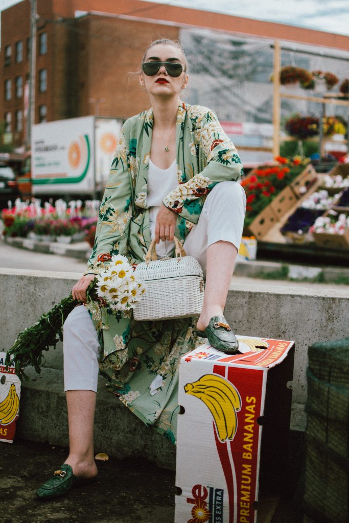 Boohoo green maxi floral kimono, floral print kimono, mango white peg trousers with belt, zara white cami top, musette tropical print leather mules, white handmade basket bag, andreea birsan, couturezilla, cute spring and summer outfit ideas 2018, white straw bag, raffia bag, wicker bag, limited edition mango bag, the cutest bags from mango, bamboo bag, tropical print and floral print, how to mix different prints in one outfit, the not so boring all white outfit for spring and summer, how to wear wide leg trousers, the peg trousers trend, pleated pants, white pants, how to wear white trousers, simple white cami top, wardrobe staples, wardrobe classics, big sunglasses, oversized sunglasses, oversize sunglasses, smoked lens sunglasses, moon necklace, white pants and top, kimono, maxi kimono, how to wear a kimono, the best way to wear a kimono in spring and summer, the popular zara sold out floral print kimono, the zara kimono, how to look Parisian chic, European summer street style inspiration for women 2017, pinterest chic outfit ideas for woman, summer outfit ideas, summer ootd inspiration, outfit of the day, ootd, fashion icon, style inspiration, fashionista, fashion inspiration, style inspo, what to wear in summer, how to look French, chic on a budget, zara outfit, mango, topshop, asos, river island, forever 21, urban outfitters, how to mix high end pieces with luxury ones, zara and Gucci,outfit alternatives for summer, tomboy chic, minimal outfit, tumblr girls photos, pictures, happy girl, women, smart casual outfits, the best outfit ideas 2017, what to wear when you don’t feel inspired, summer in Europe, weekend attire, uniform, French women in summer, European outfit ideas 2017, minimal chic outfit, how to stand out, the best outfit ideas for summer, the sunglasses you have seen everywhere on Instagram, glasses, uk fashion blogger, united kingdom, uk fashion blog, fashion and travel blog, Europe, women with style, street style, summer fashion trends 2017, best fashion ideas, styling, fall fashion, fall outfit, fall ootd, fall perfect, transitional dressing, best transitional outfit ideas, how to wear statement earrings, dressing for autumn, autumn outfit, winter outfit ideas for work and school 2017