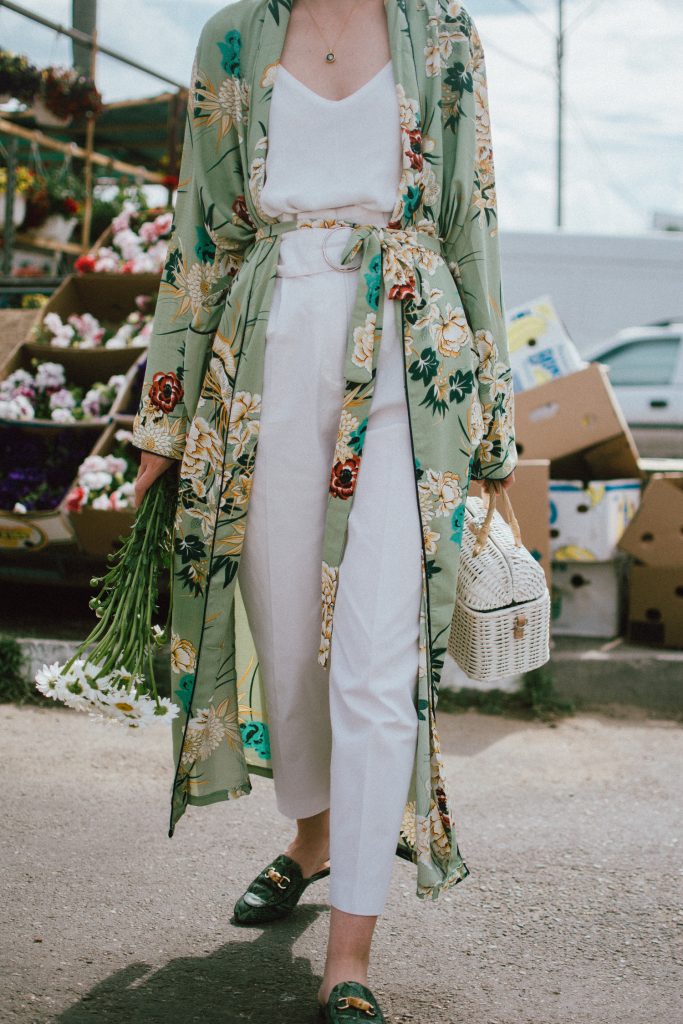 Boohoo green maxi floral kimono, floral print kimono, mango white peg trousers with belt, zara white cami top, musette tropical print leather mules, white handmade basket bag, andreea birsan, couturezilla, cute spring and summer outfit ideas 2018, white straw bag, raffia bag, wicker bag, limited edition mango bag, the cutest bags from mango, bamboo bag, tropical print and floral print, how to mix different prints in one outfit, the not so boring all white outfit for spring and summer, how to wear wide leg trousers, the peg trousers trend, pleated pants, white pants, how to wear white trousers, simple white cami top, wardrobe staples, wardrobe classics, big sunglasses, oversized sunglasses, oversize sunglasses, smoked lens sunglasses, moon necklace, white pants and top, kimono, maxi kimono, how to wear a kimono, the best way to wear a kimono in spring and summer, the popular zara sold out floral print kimono, the zara kimono, how to look Parisian chic, European summer street style inspiration for women 2017, pinterest chic outfit ideas for woman, summer outfit ideas, summer ootd inspiration, outfit of the day, ootd, fashion icon, style inspiration, fashionista, fashion inspiration, style inspo, what to wear in summer, how to look French, chic on a budget, zara outfit, mango, topshop, asos, river island, forever 21, urban outfitters, how to mix high end pieces with luxury ones, zara and Gucci,outfit alternatives for summer, tomboy chic, minimal outfit, tumblr girls photos, pictures, happy girl, women, smart casual outfits, the best outfit ideas 2017, what to wear when you don’t feel inspired, summer in Europe, weekend attire, uniform, French women in summer, European outfit ideas 2017, minimal chic outfit, how to stand out, the best outfit ideas for summer, the sunglasses you have seen everywhere on Instagram, glasses, uk fashion blogger, united kingdom, uk fashion blog, fashion and travel blog, Europe, women with style, street style, summer fashion trends 2017, best fashion ideas, styling, fall fashion, fall outfit, fall ootd, fall perfect, transitional dressing, best transitional outfit ideas, how to wear statement earrings, dressing for autumn, autumn outfit, winter outfit ideas for work and school 2017