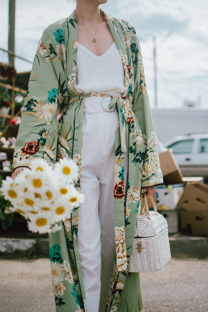 Boohoo green maxi floral kimono, floral print kimono, mango white peg trousers with belt, zara white cami top, musette tropical print leather mules, white handmade basket bag, andreea birsan, couturezilla, cute spring and summer outfit ideas 2018, white straw bag, raffia bag, wicker bag, limited edition mango bag, the cutest bags from mango, bamboo bag, tropical print and floral print, how to mix different prints in one outfit, the not so boring all white outfit for spring and summer, how to wear wide leg trousers, the peg trousers trend, pleated pants, white pants, how to wear white trousers, simple white cami top, wardrobe staples, wardrobe classics, big sunglasses, oversized sunglasses, oversize sunglasses, smoked lens sunglasses, moon necklace, white pants and top, kimono, maxi kimono, how to wear a kimono, the best way to wear a kimono in spring and summer, the popular zara sold out floral print kimono, the zara kimono, how to look Parisian chic, European summer street style inspiration for women 2017, pinterest chic outfit ideas for woman, summer outfit ideas, summer ootd inspiration, outfit of the day, ootd, fashion icon, style inspiration, fashionista, fashion inspiration, style inspo, what to wear in summer, how to look French, chic on a budget, zara outfit, mango, topshop, asos, river island, forever 21, urban outfitters, how to mix high end pieces with luxury ones, zara and Gucci,outfit alternatives for summer, tomboy chic, minimal outfit, tumblr girls photos, pictures, happy girl, women, smart casual outfits, the best outfit ideas 2017, what to wear when you don’t feel inspired, summer in Europe, weekend attire, uniform, French women in summer, European outfit ideas 2017, minimal chic outfit, how to stand out, the best outfit ideas for summer, the sunglasses you have seen everywhere on Instagram, glasses, uk fashion blogger, united kingdom, uk fashion blog, fashion and travel blog, Europe, women with style, street style, summer fashion trends 2017, best fashion ideas, styling, fall fashion, fall outfit, fall ootd, fall perfect, transitional dressing, best transitional outfit ideas, how to wear statement earrings, dressing for autumn, autumn outfit, winter outfit ideas for work and school 2017