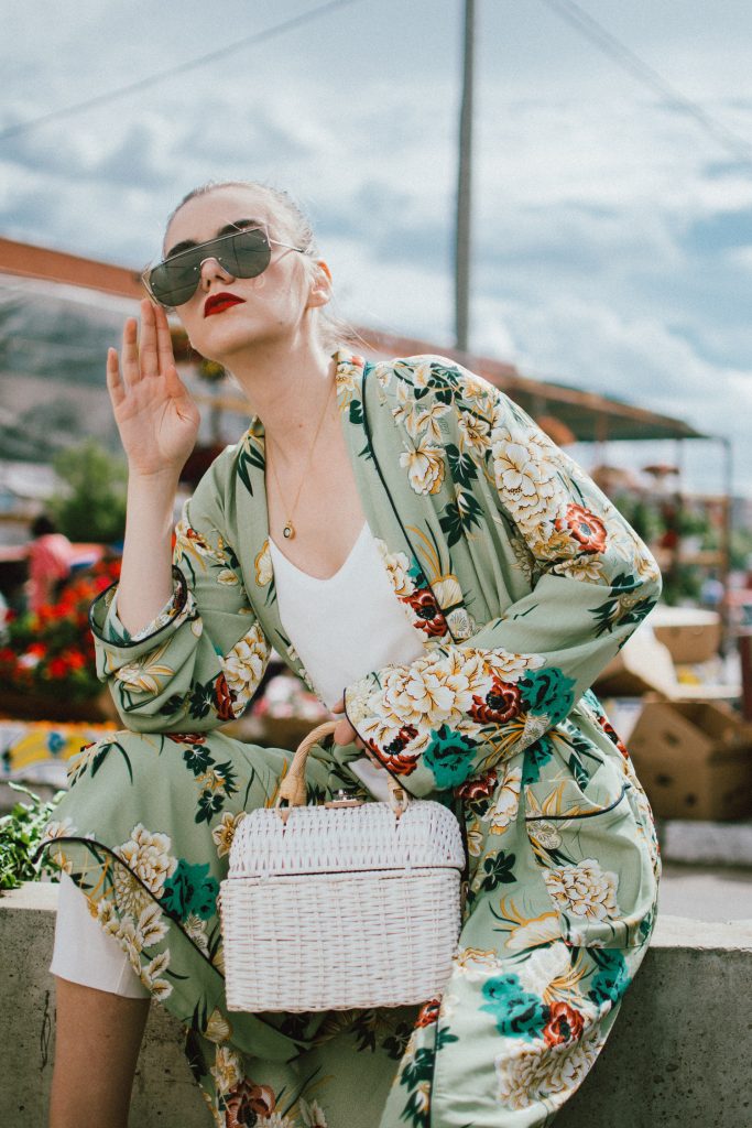 Boohoo green maxi floral kimono, floral print kimono, mango white peg trousers with belt, zara white cami top, musette tropical print leather mules, white handmade basket bag, andreea birsan, couturezilla, cute spring and summer outfit ideas 2018, white straw bag, raffia bag, wicker bag, limited edition mango bag, the cutest bags from mango, bamboo bag, tropical print and floral print, how to mix different prints in one outfit, the not so boring all white outfit for spring and summer, how to wear wide leg trousers, the peg trousers trend, pleated pants, white pants, how to wear white trousers, simple white cami top, wardrobe staples, wardrobe classics, big sunglasses, oversized sunglasses, oversize sunglasses, smoked lens sunglasses, moon necklace, white pants and top, kimono, maxi kimono, how to wear a kimono, the best way to wear a kimono in spring and summer, the popular zara sold out floral print kimono, the zara kimono, how to look Parisian chic, European summer street style inspiration for women 2017, pinterest chic outfit ideas for woman, summer outfit ideas, summer ootd inspiration, outfit of the day, ootd, fashion icon, style inspiration, fashionista, fashion inspiration, style inspo, what to wear in summer, how to look French, chic on a budget, zara outfit, mango, topshop, asos, river island, forever 21, urban outfitters, how to mix high end pieces with luxury ones, zara and Gucci,outfit alternatives for summer, tomboy chic, minimal outfit, tumblr girls photos, pictures, happy girl, women, smart casual outfits, the best outfit ideas 2017, what to wear when you don’t feel inspired, summer in Europe, weekend attire, uniform, French women in summer, European outfit ideas 2017, minimal chic outfit, how to stand out, the best outfit ideas for summer, the sunglasses you have seen everywhere on Instagram, glasses, uk fashion blogger, united kingdom, uk fashion blog, fashion and travel blog, Europe, women with style, street style, summer fashion trends 2017, best fashion ideas, styling, fall fashion, fall outfit, fall ootd, fall perfect, transitional dressing, best transitional outfit ideas, how to wear statement earrings, dressing for autumn, autumn outfit, winter outfit ideas for work and school 2017