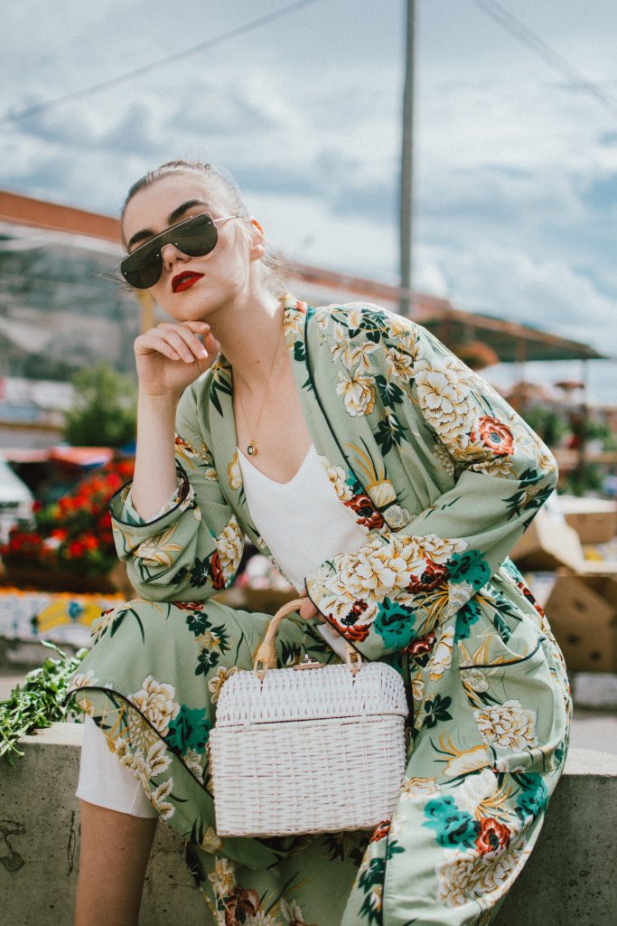 Boohoo green maxi floral kimono, floral print kimono, mango white peg trousers with belt, zara white cami top, musette tropical print leather mules, white handmade basket bag, andreea birsan, couturezilla, cute spring and summer outfit ideas 2018, white straw bag, raffia bag, wicker bag, limited edition mango bag, the cutest bags from mango, bamboo bag, tropical print and floral print, how to mix different prints in one outfit, the not so boring all white outfit for spring and summer, how to wear wide leg trousers, the peg trousers trend, pleated pants, white pants, how to wear white trousers, simple white cami top, wardrobe staples, wardrobe classics, big sunglasses, oversized sunglasses, oversize sunglasses, smoked lens sunglasses, moon necklace, white pants and top, kimono, maxi kimono, how to wear a kimono, the best way to wear a kimono in spring and summer, the popular zara sold out floral print kimono, the zara kimono, how to look Parisian chic, European summer street style inspiration for women 2017, pinterest chic outfit ideas for woman, summer outfit ideas, summer ootd inspiration, outfit of the day, ootd, fashion icon, style inspiration, fashionista, fashion inspiration, style inspo, what to wear in summer, how to look French, chic on a budget, zara outfit, mango, topshop, asos, river island, forever 21, urban outfitters, how to mix high end pieces with luxury ones, zara and Gucci,outfit alternatives for summer, tomboy chic, minimal outfit, tumblr girls photos, pictures, happy girl, women, smart casual outfits, the best outfit ideas 2017, what to wear when you don’t feel inspired, summer in Europe, weekend attire, uniform, French women in summer, European outfit ideas 2017, minimal chic outfit, how to stand out, the best outfit ideas for summer, the sunglasses you have seen everywhere on Instagram, glasses, uk fashion blogger, united kingdom, uk fashion blog, fashion and travel blog, Europe, women with style, street style, summer fashion trends 2017, best fashion ideas, styling, fall fashion, fall outfit, fall ootd, fall perfect, transitional dressing, best transitional outfit ideas, how to wear statement earrings, dressing for autumn, autumn outfit, winter outfit ideas for work and school 2017