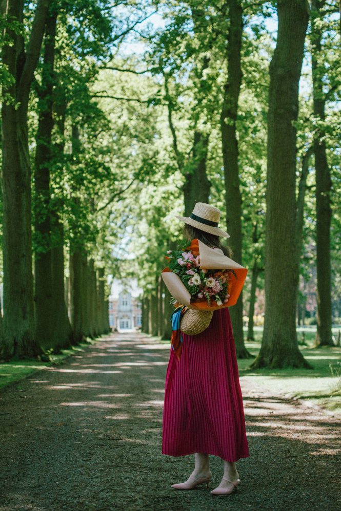 Massimo Dutti hot pink pleated maxi dress, pink suede kitten heels, wconcept shoes, straw boater hat, basket bag, peonies, schilde belgium, andreea birsan, couturezilla, cute spring outfit ideas 2018, flowers, travel to belgium, wanderlust, pink shoes and pink dress, how to wear two shades of pink in one outfit, date night outfit idea, how to wear a maxi dress, pleated maxi dress perfect for summer weddings, casual dress, chic dress, pink outfit ideas, flower bouquet, how to look Parisian chic, woven bag, basket bag, raffia bag, the best bags for summer, wicker bag, silk scarf, oval sunglasses, small sunglasses, European summer street style inspiration for women 2017, pinterest chic outfit ideas for woman, summer outfit ideas, summer ootd inspiration, outfit of the day, ootd, fashion icon, style inspiration, fashionista, fashion inspiration, style inspo, what to wear in summer, how to look French, chic on a budget, zara outfit, mango, topshop, asos, river island, forever 21, urban outfitters, how to mix high end pieces with luxury ones, zara and Gucci,outfit alternatives for summer, tomboy chic, minimal outfit, tumblr girls photos, pictures, happy girl, women, smart casual outfits, the best outfit ideas 2017, what to wear when you don’t feel inspired, summer in Europe, weekend attire, uniform, French women in summer, European outfit ideas 2017, minimal chic outfit, how to stand out, the best outfit ideas for summer, the sunglasses you have seen everywhere on Instagram, glasses, uk fashion blogger, united kingdom, uk fashion blog, fashion and travel blog, Europe, women with style, street style, summer fashion trends 2017, best fashion ideas, styling, fall fashion, fall outfit, fall ootd, fall perfect, transitional dressing, best transitional outfit ideas, how to wear statement earrings, dressing for autumn, autumn outfit, winter outfit ideas for work and school 2017