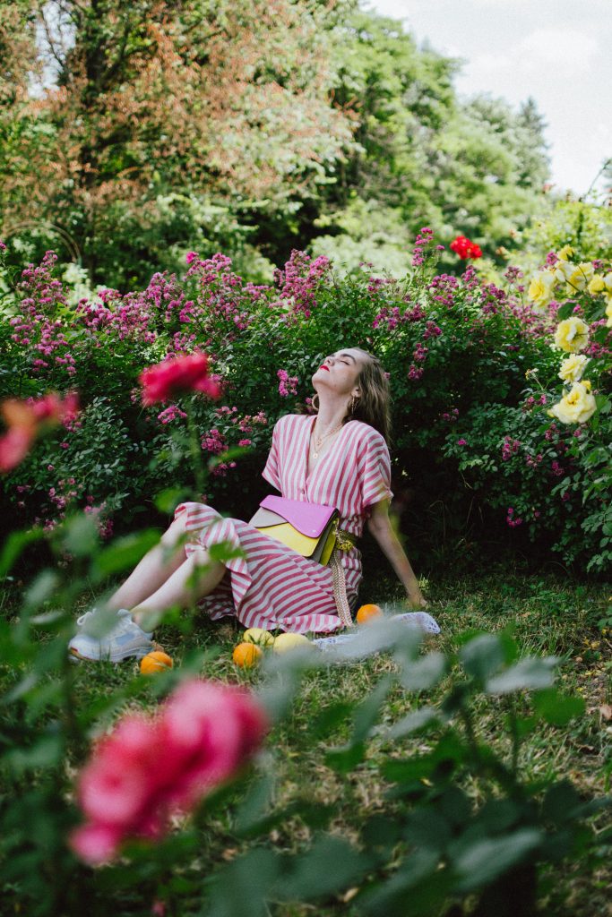 Striped midi dress, chunky white sneakers, statement colorblock shoulder bag, rose garden, coin necklace, andreea birsan, couturezilla, cute summer outfit ideas 2018, coin necklace, mango midi striped linen dress, linen dress, striped midi dress and sneakers, chunky trainers, chunky sneakers, dad sneakers trend, the ugly sneakers trend, white trainers, trainers and feminine dress, retro dress and chunky trainers, gold plated coin necklace, onecklace jewelry, isla fontaine statement shoulder bag, pink and yellow bag, the best bags from isla fontaine, mini bun hairstyle, gold metallic belt, rose garden, the necklace you need to wear this summer, red and white midi dress, crisp white sneakers, balenciaga inspired triple s sneakers, balenciaga dupe sneakers, where to find the budget alternative to the balenciaga triple s sneakers, balenciaga sneakers, trending, summer trends of 2018, how to look Parisian chic, European summer street style inspiration for women 2017, pinterest chic outfit ideas for woman, summer outfit ideas, summer ootd inspiration, outfit of the day, ootd, fashion icon, style inspiration, fashionista, fashion inspiration, style inspo, what to wear in summer, how to look French, chic on a budget, zara outfit, mango, topshop, asos, river island, forever 21, urban outfitters, how to mix high end pieces with luxury ones, zara and Gucci,outfit alternatives for summer, tomboy chic, minimal outfit, tumblr girls photos, pictures, happy girl, women, smart casual outfits, the best outfit ideas 2017, what to wear when you don’t feel inspired, summer in Europe, weekend attire, uniform, French women in summer, European outfit ideas 2017, minimal chic outfit, how to stand out, the best outfit ideas for summer, the sunglasses you have seen everywhere on Instagram, glasses, uk fashion blogger, united kingdom, uk fashion blog, fashion and travel blog, Europe, women with style, street style, summer fashion trends 2017, best fashion ideas, styling, fall fashion, fall outfit, fall ootd, fall perfect, transitional dressing, best transitional outfit ideas, how to wear statement earrings, dressing for autumn, autumn outfit, winter outfit ideas for work and school 2017