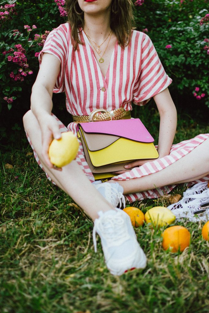 Striped midi dress, chunky white sneakers, statement colorblock shoulder bag, rose garden, coin necklace, andreea birsan, couturezilla, cute summer outfit ideas 2018, coin necklace, mango midi striped linen dress, linen dress, striped midi dress and sneakers, chunky trainers, chunky sneakers, dad sneakers trend, the ugly sneakers trend, white trainers, trainers and feminine dress, retro dress and chunky trainers, gold plated coin necklace, onecklace jewelry, isla fontaine statement shoulder bag, pink and yellow bag, the best bags from isla fontaine, mini bun hairstyle, gold metallic belt, rose garden, the necklace you need to wear this summer, red and white midi dress, crisp white sneakers, balenciaga inspired triple s sneakers, balenciaga dupe sneakers, where to find the budget alternative to the balenciaga triple s sneakers, balenciaga sneakers, trending, summer trends of 2018, how to look Parisian chic, European summer street style inspiration for women 2017, pinterest chic outfit ideas for woman, summer outfit ideas, summer ootd inspiration, outfit of the day, ootd, fashion icon, style inspiration, fashionista, fashion inspiration, style inspo, what to wear in summer, how to look French, chic on a budget, zara outfit, mango, topshop, asos, river island, forever 21, urban outfitters, how to mix high end pieces with luxury ones, zara and Gucci,outfit alternatives for summer, tomboy chic, minimal outfit, tumblr girls photos, pictures, happy girl, women, smart casual outfits, the best outfit ideas 2017, what to wear when you don’t feel inspired, summer in Europe, weekend attire, uniform, French women in summer, European outfit ideas 2017, minimal chic outfit, how to stand out, the best outfit ideas for summer, the sunglasses you have seen everywhere on Instagram, glasses, uk fashion blogger, united kingdom, uk fashion blog, fashion and travel blog, Europe, women with style, street style, summer fashion trends 2017, best fashion ideas, styling, fall fashion, fall outfit, fall ootd, fall perfect, transitional dressing, best transitional outfit ideas, how to wear statement earrings, dressing for autumn, autumn outfit, winter outfit ideas for work and school 2017