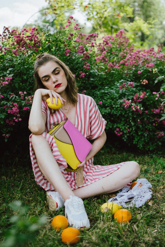 Striped midi dress, chunky white sneakers, statement colorblock shoulder bag, rose garden, coin necklace, andreea birsan, couturezilla, cute summer outfit ideas 2018, coin necklace, mango midi striped linen dress, linen dress, striped midi dress and sneakers, chunky trainers, chunky sneakers, dad sneakers trend, the ugly sneakers trend, white trainers, trainers and feminine dress, retro dress and chunky trainers, gold plated coin necklace, onecklace jewelry, isla fontaine statement shoulder bag, pink and yellow bag, the best bags from isla fontaine, mini bun hairstyle, gold metallic belt, rose garden, the necklace you need to wear this summer, red and white midi dress, crisp white sneakers, balenciaga inspired triple s sneakers, balenciaga dupe sneakers, where to find the budget alternative to the balenciaga triple s sneakers, balenciaga sneakers, trending, summer trends of 2018, how to look Parisian chic, European summer street style inspiration for women 2017, pinterest chic outfit ideas for woman, summer outfit ideas, summer ootd inspiration, outfit of the day, ootd, fashion icon, style inspiration, fashionista, fashion inspiration, style inspo, what to wear in summer, how to look French, chic on a budget, zara outfit, mango, topshop, asos, river island, forever 21, urban outfitters, how to mix high end pieces with luxury ones, zara and Gucci,outfit alternatives for summer, tomboy chic, minimal outfit, tumblr girls photos, pictures, happy girl, women, smart casual outfits, the best outfit ideas 2017, what to wear when you don’t feel inspired, summer in Europe, weekend attire, uniform, French women in summer, European outfit ideas 2017, minimal chic outfit, how to stand out, the best outfit ideas for summer, the sunglasses you have seen everywhere on Instagram, glasses, uk fashion blogger, united kingdom, uk fashion blog, fashion and travel blog, Europe, women with style, street style, summer fashion trends 2017, best fashion ideas, styling, fall fashion, fall outfit, fall ootd, fall perfect, transitional dressing, best transitional outfit ideas, how to wear statement earrings, dressing for autumn, autumn outfit, winter outfit ideas for work and school 2017