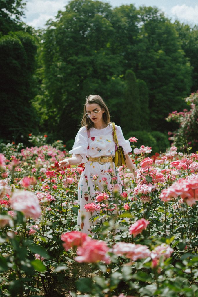 White puffy sleeves shirt, layered button front midi dress, gold metallic vintage belt, colorblock leather shoulder bag, pink mules, rose gorden editorial, andreea birsan, couturezilla, cute summer outfit ideas for 2018, step up your midi dress, how to wear a midi dress, printed dress, cotton dress, ottod’ame dress, rose gardens in bucharest, trandafiri bucuresti, gradina botanica, botanical garden, fun dress, cotton and linen, white shirt with puffy sleeves, the perfect midi dress for summer, marcie wconcept pink suede mules, korean shoes, korean mules, korean designer shoes, italian dress, beautiful bag, statement bag, yellow and pink shoulder bag, statement bag strap, isla fontaine bags, italian leather bags, how to layer a midi dress when it’s melting outside, the midi dress you should wear this summer, how to wear a puffy sleeve top, white shirt, wardrobe must have, staples, how to look Parisian chic, European summer street style inspiration for women 2017, pinterest chic outfit ideas for woman, summer outfit ideas, summer ootd inspiration, outfit of the day, ootd, fashion icon, style inspiration, fashionista, fashion inspiration, style inspo, what to wear in summer, how to look French, chic on a budget, zara outfit, mango, topshop, asos, river island, forever 21, urban outfitters, how to mix high end pieces with luxury ones, zara and Gucci,outfit alternatives for summer, tomboy chic, minimal outfit, tumblr girls photos, pictures, happy girl, women, smart casual outfits, the best outfit ideas 2017, what to wear when you don’t feel inspired, summer in Europe, weekend attire, uniform, French women in summer, European outfit ideas 2017, minimal chic outfit, how to stand out, the best outfit ideas for summer, the sunglasses you have seen everywhere on Instagram, glasses, uk fashion blogger, united kingdom, uk fashion blog, fashion and travel blog, Europe, women with style, street style, summer fashion trends 2017, best fashion ideas, styling, fall fashion, fall outfit, fall ootd, fall perfect, transitional dressing, best transitional outfit ideas, how to wear statement earrings, dressing for autumn, autumn outfit, winter outfit ideas for work and school 2017, clear lens aviator glasses, geeky glasses, clear lens glasses trend