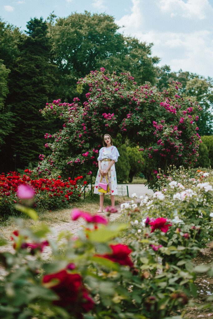 White puffy sleeves shirt, layered button front midi dress, gold metallic vintage belt, colorblock leather shoulder bag, pink mules, rose gorden editorial, andreea birsan, couturezilla, cute summer outfit ideas for 2018, step up your midi dress, how to wear a midi dress, printed dress, cotton dress, ottod’ame dress, rose gardens in bucharest, trandafiri bucuresti, gradina botanica, botanical garden, fun dress, cotton and linen, white shirt with puffy sleeves, the perfect midi dress for summer, marcie wconcept pink suede mules, korean shoes, korean mules, korean designer shoes, italian dress, beautiful bag, statement bag, yellow and pink shoulder bag, statement bag strap, isla fontaine bags, italian leather bags, how to layer a midi dress when it’s melting outside, the midi dress you should wear this summer, how to wear a puffy sleeve top, white shirt, wardrobe must have, staples, how to look Parisian chic, European summer street style inspiration for women 2017, pinterest chic outfit ideas for woman, summer outfit ideas, summer ootd inspiration, outfit of the day, ootd, fashion icon, style inspiration, fashionista, fashion inspiration, style inspo, what to wear in summer, how to look French, chic on a budget, zara outfit, mango, topshop, asos, river island, forever 21, urban outfitters, how to mix high end pieces with luxury ones, zara and Gucci,outfit alternatives for summer, tomboy chic, minimal outfit, tumblr girls photos, pictures, happy girl, women, smart casual outfits, the best outfit ideas 2017, what to wear when you don’t feel inspired, summer in Europe, weekend attire, uniform, French women in summer, European outfit ideas 2017, minimal chic outfit, how to stand out, the best outfit ideas for summer, the sunglasses you have seen everywhere on Instagram, glasses, uk fashion blogger, united kingdom, uk fashion blog, fashion and travel blog, Europe, women with style, street style, summer fashion trends 2017, best fashion ideas, styling, fall fashion, fall outfit, fall ootd, fall perfect, transitional dressing, best transitional outfit ideas, how to wear statement earrings, dressing for autumn, autumn outfit, winter outfit ideas for work and school 2017, clear lens aviator glasses, geeky glasses, clear lens glasses trend