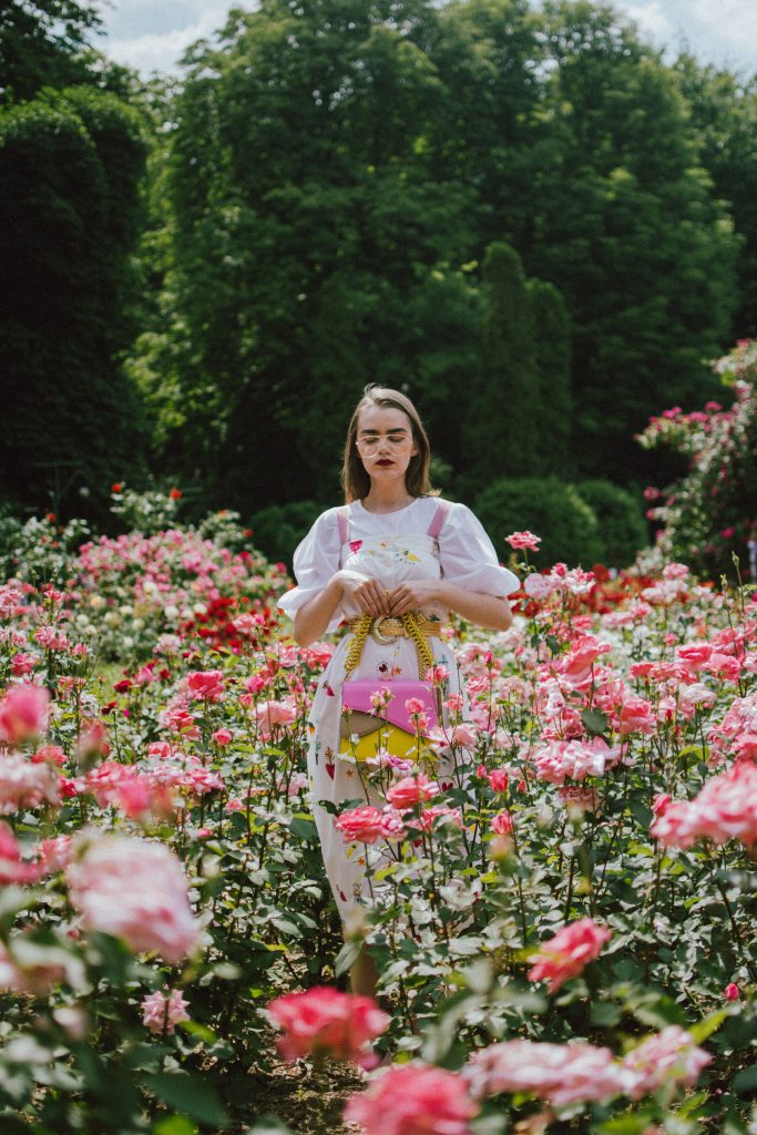 White puffy sleeves shirt, layered button front midi dress, gold metallic vintage belt, colorblock leather shoulder bag, pink mules, rose gorden editorial, andreea birsan, couturezilla, cute summer outfit ideas for 2018, step up your midi dress, how to wear a midi dress, printed dress, cotton dress, ottod’ame dress, rose gardens in bucharest, trandafiri bucuresti, gradina botanica, botanical garden, fun dress, cotton and linen, white shirt with puffy sleeves, the perfect midi dress for summer, marcie wconcept pink suede mules, korean shoes, korean mules, korean designer shoes, italian dress, beautiful bag, statement bag, yellow and pink shoulder bag, statement bag strap, isla fontaine bags, italian leather bags, how to layer a midi dress when it’s melting outside, the midi dress you should wear this summer, how to wear a puffy sleeve top, white shirt, wardrobe must have, staples, how to look Parisian chic, European summer street style inspiration for women 2017, pinterest chic outfit ideas for woman, summer outfit ideas, summer ootd inspiration, outfit of the day, ootd, fashion icon, style inspiration, fashionista, fashion inspiration, style inspo, what to wear in summer, how to look French, chic on a budget, zara outfit, mango, topshop, asos, river island, forever 21, urban outfitters, how to mix high end pieces with luxury ones, zara and Gucci,outfit alternatives for summer, tomboy chic, minimal outfit, tumblr girls photos, pictures, happy girl, women, smart casual outfits, the best outfit ideas 2017, what to wear when you don’t feel inspired, summer in Europe, weekend attire, uniform, French women in summer, European outfit ideas 2017, minimal chic outfit, how to stand out, the best outfit ideas for summer, the sunglasses you have seen everywhere on Instagram, glasses, uk fashion blogger, united kingdom, uk fashion blog, fashion and travel blog, Europe, women with style, street style, summer fashion trends 2017, best fashion ideas, styling, fall fashion, fall outfit, fall ootd, fall perfect, transitional dressing, best transitional outfit ideas, how to wear statement earrings, dressing for autumn, autumn outfit, winter outfit ideas for work and school 2017, clear lens aviator glasses, geeky glasses, clear lens glasses trend