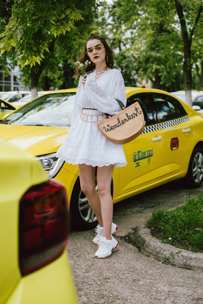 Na-kd mini white crochet dress, chunky trainers, wanderlust straw bag, chain belt, aviator glasses, andreea birsan, couturezilla, cute summer outfit ideas 2018, how to wear a girly dress with sneakers, girly dress and dad sneakers, the ugly sneakers trend, how to wear the ugly balenciaga triple s sneakers, balenciaga inspired triple s sneakers, where to find the best high street alternative to the balenciaga ugly sneakers, dad trainers trend, white sneakers, shoes that go well with everything, mini white crochet dress, white dress and white sneakers, mini dress, how to wear a mini dress without looking vulgar, feminine dresses, lace up detail white dress, zara clear lens aviator glasses, the clear lens glasses trend, how to wear the geeky glasses you keep seeing all over instagram, how to wear the ugly sneakers you keep seeing online, the chain belt trend, vintage looking chain belt, what belts to wear this summer, now trending chain belts, la femme belt, feminist, straw basket bag, handmade bag, wanderlust bag, the best summer bags, bag with wooden handle, thailand handmade bag, boho peach straw bag, raffia bag, chic bags for summer, wicker bag, basket bag, chunky white sneakers, how to look Parisian chic, European summer street style inspiration for women 2017, pinterest chic outfit ideas for woman, summer outfit ideas, summer ootd inspiration, outfit of the day, ootd, fashion icon, style inspiration, fashionista, fashion inspiration, style inspo, what to wear in summer, how to look French, chic on a budget, zara outfit, mango, topshop, asos, river island, forever 21, urban outfitters, how to mix high end pieces with luxury ones, zara and Gucci,outfit alternatives for summer, tomboy chic, minimal outfit, tumblr girls photos, pictures, happy girl, women, smart casual outfits, the best outfit ideas 2017, what to wear when you don’t feel inspired, summer in Europe, weekend attire, uniform, French women in summer, European outfit ideas 2017, minimal chic outfit, how to stand out, the best outfit ideas for summer, the sunglasses you have seen everywhere on Instagram, glasses, uk fashion blogger, united kingdom, uk fashion blog, fashion and travel blog, Europe, women with style, street style, summer fashion trends 2017, best fashion ideas, styling, fall fashion, fall outfit, fall ootd, fall perfect, transitional dressing, best transitional outfit ideas, how to wear statement earrings, dressing for autumn, autumn outfit, winter outfit ideas for work and school 2017