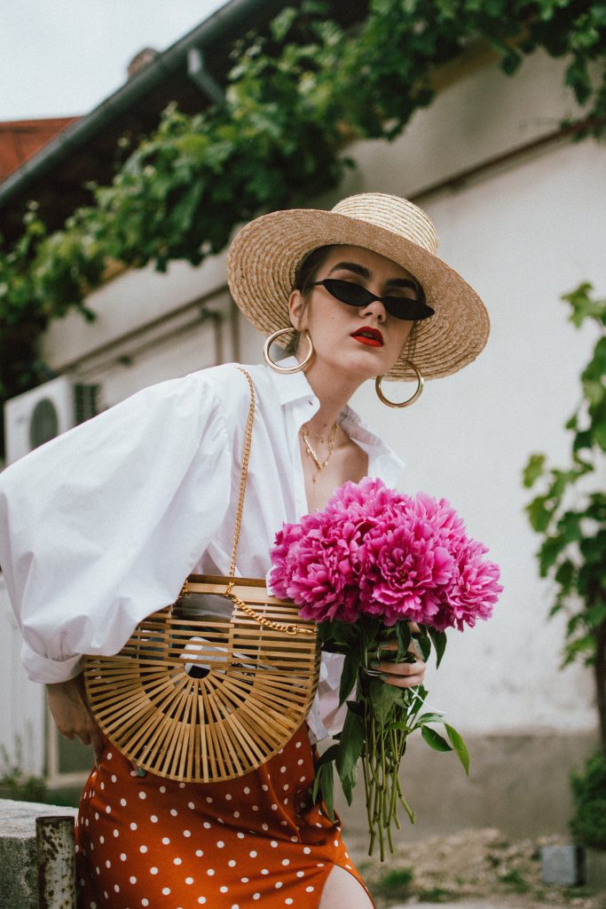 Orange boohoo midi polka dot midi dress, mango white balloon sleeve shirt shirt, h&m natural straw hat, cult gaia ark bag, tommy hilfiger white sneakers, andreea birsan, couturezilla, cute summer outfit ideas 2018. white trainers and dress, midi dress and sneakers, what to wear with a polka dot dress, midi polka dot dress with slit, orange dress, how to wear orange, what to wear with orange, rust color dress, what colors to wear this summer, how to wear sneakers and dresses, mixing feminine with masculine elements, athleisure, sexy polka dot dress, boater hat, cult gaia ark inspired bag, petite sardine bag, portuguese bag, bamboo bag, how to wear a white shirt, button up shirt, cotton shirt, how to layer in summer, layered summer dress, summer layers, white sneakers, white trainers, tommy hilfiger, gold accessories, small cat eye sunglasses, 90s inspired sunglasses, micro sunglasses trend, mini sunglasses, cat eye sunnies, the sold out asos sunglasses, chic bags to wear in spring and summer, raffia bag, straw bag, handmade bag, peonies, how to look Parisian chic, European summer street style inspiration for women 2017, pinterest chic outfit ideas for woman, summer outfit ideas, summer ootd inspiration, outfit of the day, ootd, fashion icon, style inspiration, fashionista, fashion inspiration, style inspo, what to wear in summer, how to look French, chic on a budget, zara outfit, mango, topshop, asos, river island, forever 21, urban outfitters, how to mix high end pieces with luxury ones, zara and Gucci,outfit alternatives for summer, tomboy chic, minimal outfit, tumblr girls photos, pictures, happy girl, women, smart casual outfits, the best outfit ideas 2017, what to wear when you don’t feel inspired, summer in Europe, weekend attire, uniform, French women in summer, European outfit ideas 2017, minimal chic outfit, how to stand out, the best outfit ideas for summer, the sunglasses you have seen everywhere on Instagram, glasses, uk fashion blogger, united kingdom, uk fashion blog, fashion and travel blog, Europe, women with style, street style, summer fashion trends 2017, best fashion ideas, styling, fall fashion, fall outfit, fall ootd, fall perfect, transitional dressing, best transitional outfit ideas, how to wear statement earrings, dressing for autumn, autumn outfit, winter outfit ideas for work and school 2017