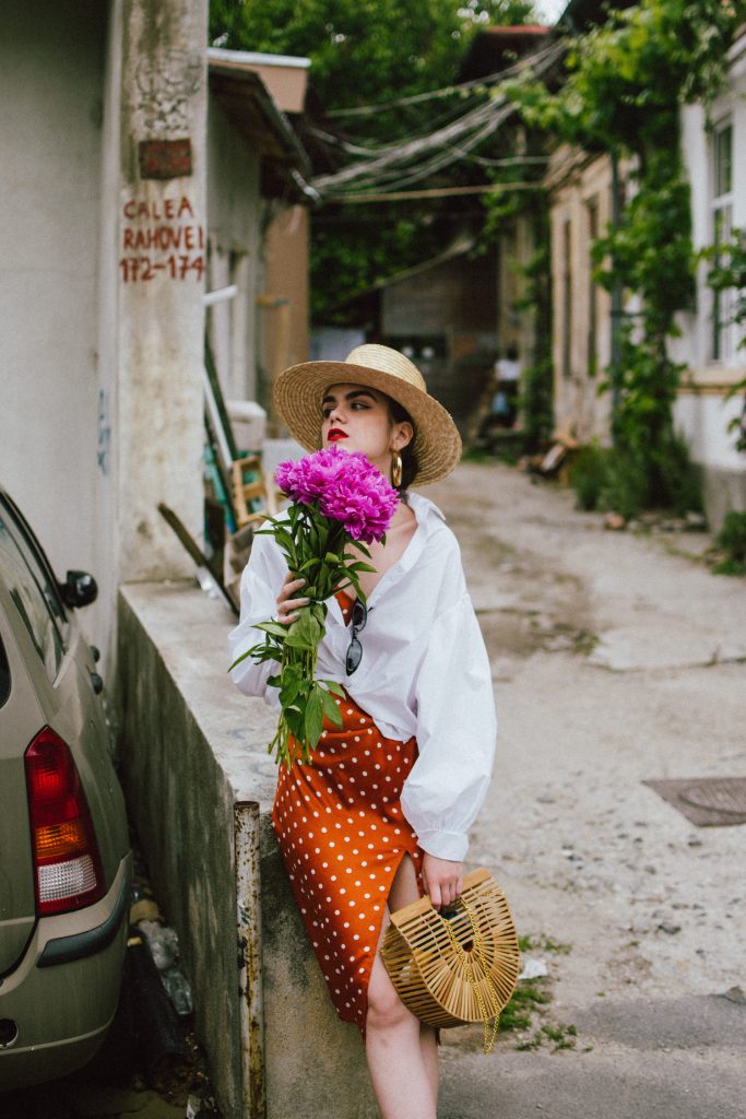 Orange boohoo midi polka dot midi dress, mango white balloon sleeve shirt shirt, h&m natural straw hat, cult gaia ark bag, tommy hilfiger white sneakers, andreea birsan, couturezilla, cute summer outfit ideas 2018. white trainers and dress, midi dress and sneakers, what to wear with a polka dot dress, midi polka dot dress with slit, orange dress, how to wear orange, what to wear with orange, rust color dress, what colors to wear this summer, how to wear sneakers and dresses, mixing feminine with masculine elements, athleisure, sexy polka dot dress, boater hat, cult gaia ark inspired bag, petite sardine bag, portuguese bag, bamboo bag, how to wear a white shirt, button up shirt, cotton shirt, how to layer in summer, layered summer dress, summer layers, white sneakers, white trainers, tommy hilfiger, gold accessories, small cat eye sunglasses, 90s inspired sunglasses, micro sunglasses trend, mini sunglasses, cat eye sunnies, the sold out asos sunglasses, chic bags to wear in spring and summer, raffia bag, straw bag, handmade bag, peonies, how to look Parisian chic, European summer street style inspiration for women 2017, pinterest chic outfit ideas for woman, summer outfit ideas, summer ootd inspiration, outfit of the day, ootd, fashion icon, style inspiration, fashionista, fashion inspiration, style inspo, what to wear in summer, how to look French, chic on a budget, zara outfit, mango, topshop, asos, river island, forever 21, urban outfitters, how to mix high end pieces with luxury ones, zara and Gucci,outfit alternatives for summer, tomboy chic, minimal outfit, tumblr girls photos, pictures, happy girl, women, smart casual outfits, the best outfit ideas 2017, what to wear when you don’t feel inspired, summer in Europe, weekend attire, uniform, French women in summer, European outfit ideas 2017, minimal chic outfit, how to stand out, the best outfit ideas for summer, the sunglasses you have seen everywhere on Instagram, glasses, uk fashion blogger, united kingdom, uk fashion blog, fashion and travel blog, Europe, women with style, street style, summer fashion trends 2017, best fashion ideas, styling, fall fashion, fall outfit, fall ootd, fall perfect, transitional dressing, best transitional outfit ideas, how to wear statement earrings, dressing for autumn, autumn outfit, winter outfit ideas for work and school 2017