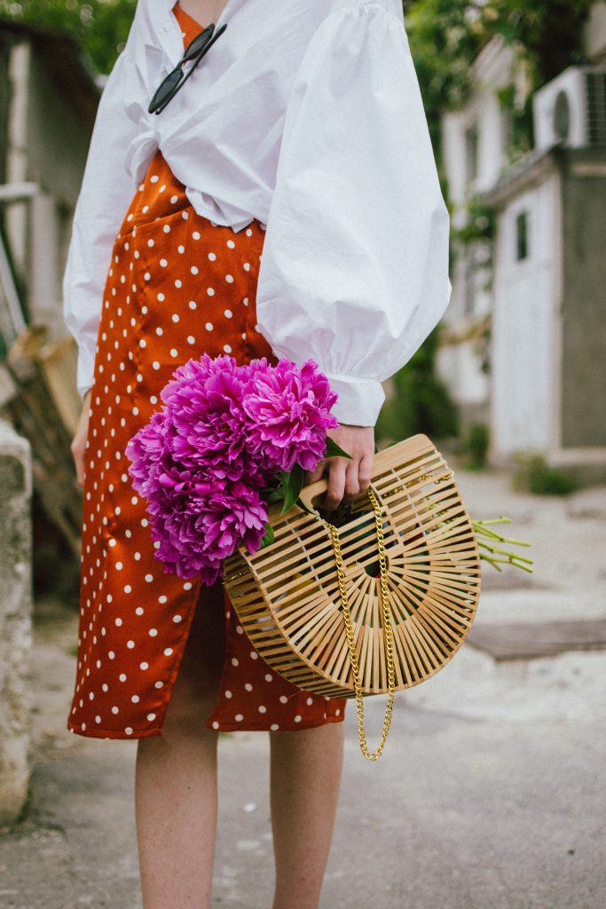 Orange boohoo midi polka dot midi dress, mango white balloon sleeve shirt shirt, h&m natural straw hat, cult gaia ark bag, tommy hilfiger white sneakers, andreea birsan, couturezilla, cute summer outfit ideas 2018. white trainers and dress, midi dress and sneakers, what to wear with a polka dot dress, midi polka dot dress with slit, orange dress, how to wear orange, what to wear with orange, rust color dress, what colors to wear this summer, how to wear sneakers and dresses, mixing feminine with masculine elements, athleisure, sexy polka dot dress, boater hat, cult gaia ark inspired bag, petite sardine bag, portuguese bag, bamboo bag, how to wear a white shirt, button up shirt, cotton shirt, how to layer in summer, layered summer dress, summer layers, white sneakers, white trainers, tommy hilfiger, gold accessories, small cat eye sunglasses, 90s inspired sunglasses, micro sunglasses trend, mini sunglasses, cat eye sunnies, the sold out asos sunglasses, chic bags to wear in spring and summer, raffia bag, straw bag, handmade bag, peonies, how to look Parisian chic, European summer street style inspiration for women 2017, pinterest chic outfit ideas for woman, summer outfit ideas, summer ootd inspiration, outfit of the day, ootd, fashion icon, style inspiration, fashionista, fashion inspiration, style inspo, what to wear in summer, how to look French, chic on a budget, zara outfit, mango, topshop, asos, river island, forever 21, urban outfitters, how to mix high end pieces with luxury ones, zara and Gucci,outfit alternatives for summer, tomboy chic, minimal outfit, tumblr girls photos, pictures, happy girl, women, smart casual outfits, the best outfit ideas 2017, what to wear when you don’t feel inspired, summer in Europe, weekend attire, uniform, French women in summer, European outfit ideas 2017, minimal chic outfit, how to stand out, the best outfit ideas for summer, the sunglasses you have seen everywhere on Instagram, glasses, uk fashion blogger, united kingdom, uk fashion blog, fashion and travel blog, Europe, women with style, street style, summer fashion trends 2017, best fashion ideas, styling, fall fashion, fall outfit, fall ootd, fall perfect, transitional dressing, best transitional outfit ideas, how to wear statement earrings, dressing for autumn, autumn outfit, winter outfit ideas for work and school 2017