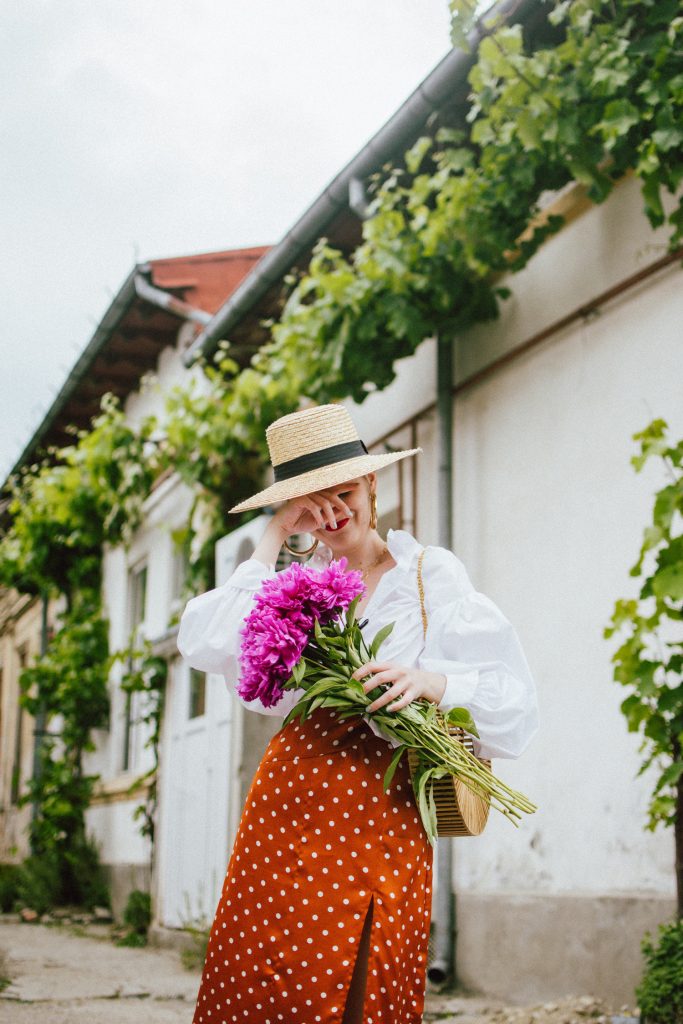 Orange boohoo midi polka dot midi dress, mango white balloon sleeve shirt shirt, h&m natural straw hat, cult gaia ark bag, tommy hilfiger white sneakers, andreea birsan, couturezilla, cute summer outfit ideas 2018. white trainers and dress, midi dress and sneakers, what to wear with a polka dot dress, midi polka dot dress with slit, orange dress, how to wear orange, what to wear with orange, rust color dress, what colors to wear this summer, how to wear sneakers and dresses, mixing feminine with masculine elements, athleisure, sexy polka dot dress, boater hat, cult gaia ark inspired bag, petite sardine bag, portuguese bag, bamboo bag, how to wear a white shirt, button up shirt, cotton shirt, how to layer in summer, layered summer dress, summer layers, white sneakers, white trainers, tommy hilfiger, gold accessories, small cat eye sunglasses, 90s inspired sunglasses, micro sunglasses trend, mini sunglasses, cat eye sunnies, the sold out asos sunglasses, chic bags to wear in spring and summer, raffia bag, straw bag, handmade bag, peonies, how to look Parisian chic, European summer street style inspiration for women 2017, pinterest chic outfit ideas for woman, summer outfit ideas, summer ootd inspiration, outfit of the day, ootd, fashion icon, style inspiration, fashionista, fashion inspiration, style inspo, what to wear in summer, how to look French, chic on a budget, zara outfit, mango, topshop, asos, river island, forever 21, urban outfitters, how to mix high end pieces with luxury ones, zara and Gucci,outfit alternatives for summer, tomboy chic, minimal outfit, tumblr girls photos, pictures, happy girl, women, smart casual outfits, the best outfit ideas 2017, what to wear when you don’t feel inspired, summer in Europe, weekend attire, uniform, French women in summer, European outfit ideas 2017, minimal chic outfit, how to stand out, the best outfit ideas for summer, the sunglasses you have seen everywhere on Instagram, glasses, uk fashion blogger, united kingdom, uk fashion blog, fashion and travel blog, Europe, women with style, street style, summer fashion trends 2017, best fashion ideas, styling, fall fashion, fall outfit, fall ootd, fall perfect, transitional dressing, best transitional outfit ideas, how to wear statement earrings, dressing for autumn, autumn outfit, winter outfit ideas for work and school 2017