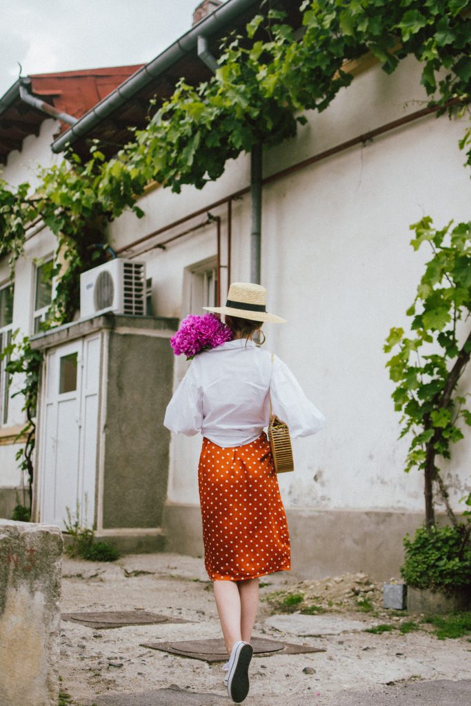 Orange boohoo midi polka dot midi dress, mango white balloon sleeve shirt shirt, h&m natural straw hat, cult gaia ark bag, tommy hilfiger white sneakers, andreea birsan, couturezilla, cute summer outfit ideas 2018. white trainers and dress, midi dress and sneakers, what to wear with a polka dot dress, midi polka dot dress with slit, orange dress, how to wear orange, what to wear with orange, rust color dress, what colors to wear this summer, how to wear sneakers and dresses, mixing feminine with masculine elements, athleisure, sexy polka dot dress, boater hat, cult gaia ark inspired bag, petite sardine bag, portuguese bag, bamboo bag, how to wear a white shirt, button up shirt, cotton shirt, how to layer in summer, layered summer dress, summer layers, white sneakers, white trainers, tommy hilfiger, gold accessories, small cat eye sunglasses, 90s inspired sunglasses, micro sunglasses trend, mini sunglasses, cat eye sunnies, the sold out asos sunglasses, chic bags to wear in spring and summer, raffia bag, straw bag, handmade bag, peonies, how to look Parisian chic, European summer street style inspiration for women 2017, pinterest chic outfit ideas for woman, summer outfit ideas, summer ootd inspiration, outfit of the day, ootd, fashion icon, style inspiration, fashionista, fashion inspiration, style inspo, what to wear in summer, how to look French, chic on a budget, zara outfit, mango, topshop, asos, river island, forever 21, urban outfitters, how to mix high end pieces with luxury ones, zara and Gucci,outfit alternatives for summer, tomboy chic, minimal outfit, tumblr girls photos, pictures, happy girl, women, smart casual outfits, the best outfit ideas 2017, what to wear when you don’t feel inspired, summer in Europe, weekend attire, uniform, French women in summer, European outfit ideas 2017, minimal chic outfit, how to stand out, the best outfit ideas for summer, the sunglasses you have seen everywhere on Instagram, glasses, uk fashion blogger, united kingdom, uk fashion blog, fashion and travel blog, Europe, women with style, street style, summer fashion trends 2017, best fashion ideas, styling, fall fashion, fall outfit, fall ootd, fall perfect, transitional dressing, best transitional outfit ideas, how to wear statement earrings, dressing for autumn, autumn outfit, winter outfit ideas for work and school 2017