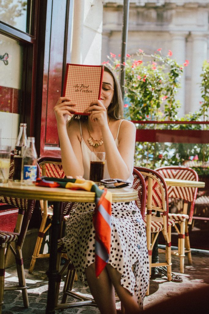 Zara polka dot skirt, white cami top, gucci ace heart sneakers, cherry pom pom straw summer bag, paris, andreea birsan, couturezilla, cute summer outfit ideas 2018, polka dot midi skirt, spaghetti straps white camisole top, mango white, white and black midi skirt, the zara sold out polka dot skirt, basic white cami top, how to wear a midi skirt, what to wear with a midi polka dot skirt, how to style a polka dot skirt, how to wear a polka dot skirt, gucci trainers, gucci ace heart embroidered sneakers, white trainers, heart embroidery, white leather shoes, parisian cafe, skirt and sneakers, shell accessories, shell necklaces, gold layered necklaces, gucci inspired embellished square sunglasses, 90s sunglasses, black sunglasses, printed silk scarf, clear lens aviator glasses, zara glasses, the geeky glasses trend, the clear lens glasses trend you’ve seen on instagram, popular glasses, gucci 90s inspired square embellished sunglasses with rhinestones, pom pom summer bag, straw bag, asos sold out summer bag, raffia tote bag, statement summer bag, how to look Parisian chic, European summer street style inspiration for women 2017, pinterest chic outfit ideas for woman, summer outfit ideas, summer ootd inspiration, outfit of the day, ootd, fashion icon, style inspiration, fashionista, fashion inspiration, style inspo, what to wear in summer, how to look French, chic on a budget, zara outfit, mango, topshop, asos, river island, forever 21, urban outfitters, how to mix high end pieces with luxury ones, zara and Gucci,outfit alternatives for summer, tomboy chic, minimal outfit, tumblr girls photos, pictures, happy girl, women, smart casual outfits, the best outfit ideas 2017, what to wear when you don’t feel inspired, summer in Europe, weekend attire, uniform, French women in summer, European outfit ideas 2017, minimal chic outfit, how to stand out, the best outfit ideas for summer, the sunglasses you have seen everywhere on Instagram, glasses, uk fashion blogger, united kingdom, uk fashion blog, fashion and travel blog, Europe, women with style, street style, summer fashion trends 2017, best fashion ideas, styling, fall fashion, fall outfit, fall ootd, fall perfect, transitional dressing, best transitional outfit ideas, how to wear statement earrings, dressing for autumn, autumn outfit, winter outfit ideas for work and school 2017