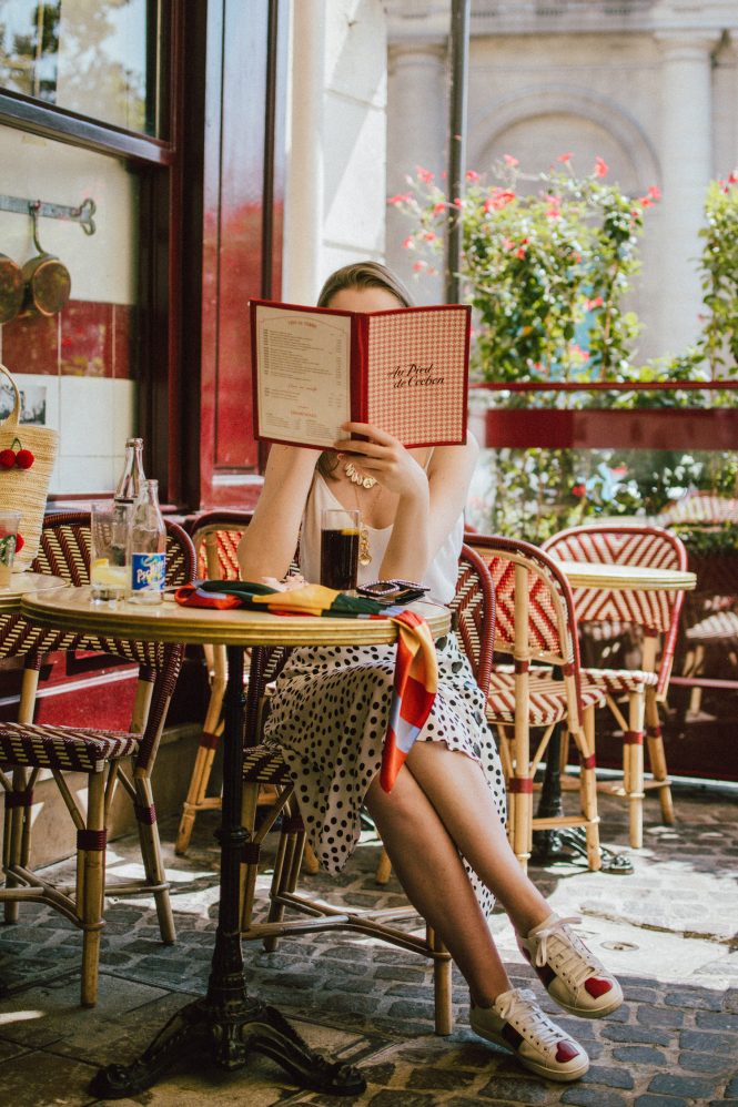 Zara polka dot skirt, white cami top, gucci ace heart sneakers, cherry pom pom straw summer bag, paris, andreea birsan, couturezilla, cute summer outfit ideas 2018, polka dot midi skirt, spaghetti straps white camisole top, mango white, white and black midi skirt, the zara sold out polka dot skirt, basic white cami top, how to wear a midi skirt, what to wear with a midi polka dot skirt, how to style a polka dot skirt, how to wear a polka dot skirt, gucci trainers, gucci ace heart embroidered sneakers, white trainers, heart embroidery, white leather shoes, parisian cafe, skirt and sneakers, shell accessories, shell necklaces, gold layered necklaces, gucci inspired embellished square sunglasses, 90s sunglasses, black sunglasses, printed silk scarf, clear lens aviator glasses, zara glasses, the geeky glasses trend, the clear lens glasses trend you’ve seen on instagram, popular glasses, gucci 90s inspired square embellished sunglasses with rhinestones, pom pom summer bag, straw bag, asos sold out summer bag, raffia tote bag, statement summer bag, how to look Parisian chic, European summer street style inspiration for women 2017, pinterest chic outfit ideas for woman, summer outfit ideas, summer ootd inspiration, outfit of the day, ootd, fashion icon, style inspiration, fashionista, fashion inspiration, style inspo, what to wear in summer, how to look French, chic on a budget, zara outfit, mango, topshop, asos, river island, forever 21, urban outfitters, how to mix high end pieces with luxury ones, zara and Gucci,outfit alternatives for summer, tomboy chic, minimal outfit, tumblr girls photos, pictures, happy girl, women, smart casual outfits, the best outfit ideas 2017, what to wear when you don’t feel inspired, summer in Europe, weekend attire, uniform, French women in summer, European outfit ideas 2017, minimal chic outfit, how to stand out, the best outfit ideas for summer, the sunglasses you have seen everywhere on Instagram, glasses, uk fashion blogger, united kingdom, uk fashion blog, fashion and travel blog, Europe, women with style, street style, summer fashion trends 2017, best fashion ideas, styling, fall fashion, fall outfit, fall ootd, fall perfect, transitional dressing, best transitional outfit ideas, how to wear statement earrings, dressing for autumn, autumn outfit, winter outfit ideas for work and school 2017