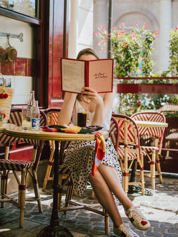 Zara polka dot skirt, white cami top, gucci ace heart sneakers, cherry pom pom straw summer bag, paris, andreea birsan, couturezilla, cute summer outfit ideas 2018, polka dot midi skirt, spaghetti straps white camisole top, mango white, white and black midi skirt, the zara sold out polka dot skirt, basic white cami top, how to wear a midi skirt, what to wear with a midi polka dot skirt, how to style a polka dot skirt, how to wear a polka dot skirt, gucci trainers, gucci ace heart embroidered sneakers, white trainers, heart embroidery, white leather shoes, parisian cafe, skirt and sneakers, shell accessories, shell necklaces, gold layered necklaces, gucci inspired embellished square sunglasses, 90s sunglasses, black sunglasses, printed silk scarf, clear lens aviator glasses, zara glasses, the geeky glasses trend, the clear lens glasses trend you’ve seen on instagram, popular glasses, gucci 90s inspired square embellished sunglasses with rhinestones, pom pom summer bag, straw bag, asos sold out summer bag, raffia tote bag, statement summer bag, how to look Parisian chic, European summer street style inspiration for women 2017, pinterest chic outfit ideas for woman, summer outfit ideas, summer ootd inspiration, outfit of the day, ootd, fashion icon, style inspiration, fashionista, fashion inspiration, style inspo, what to wear in summer, how to look French, chic on a budget, zara outfit, mango, topshop, asos, river island, forever 21, urban outfitters, how to mix high end pieces with luxury ones, zara and Gucci,outfit alternatives for summer, tomboy chic, minimal outfit, tumblr girls photos, pictures, happy girl, women, smart casual outfits, the best outfit ideas 2017, what to wear when you don’t feel inspired, summer in Europe, weekend attire, uniform, French women in summer, European outfit ideas 2017, minimal chic outfit, how to stand out, the best outfit ideas for summer, the sunglasses you have seen everywhere on Instagram, glasses, uk fashion blogger, united kingdom, uk fashion blog, fashion and travel blog, Europe, women with style, street style, summer fashion trends 2017, best fashion ideas, styling, fall fashion, fall outfit, fall ootd, fall perfect, transitional dressing, best transitional outfit ideas, how to wear statement earrings, dressing for autumn, autumn outfit, winter outfit ideas for work and school 2017