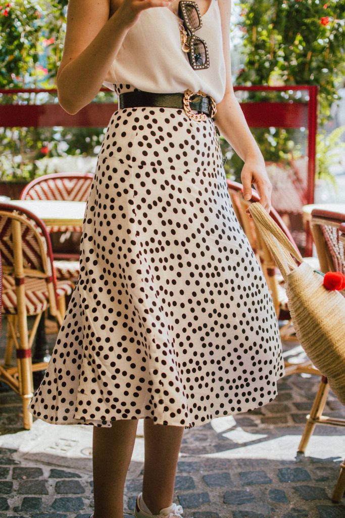 Zara polka dot skirt, white cami top, gucci ace heart sneakers, cherry pom pom straw summer bag, paris, andreea birsan, couturezilla, cute summer outfit ideas 2018, polka dot midi skirt, spaghetti straps white camisole top, mango white, white and black midi skirt, the zara sold out polka dot skirt, basic white cami top, how to wear a midi skirt, what to wear with a midi polka dot skirt, how to style a polka dot skirt, how to wear a polka dot skirt, gucci trainers, gucci ace heart embroidered sneakers, white trainers, heart embroidery, white leather shoes, parisian cafe, skirt and sneakers, shell accessories, shell necklaces, gold layered necklaces, gucci inspired embellished square sunglasses, 90s sunglasses, black sunglasses, printed silk scarf, clear lens aviator glasses, zara glasses, the geeky glasses trend, the clear lens glasses trend you’ve seen on instagram, popular glasses, gucci 90s inspired square embellished sunglasses with rhinestones, pom pom summer bag, straw bag, asos sold out summer bag, raffia tote bag, statement summer bag, how to look Parisian chic, European summer street style inspiration for women 2017, pinterest chic outfit ideas for woman, summer outfit ideas, summer ootd inspiration, outfit of the day, ootd, fashion icon, style inspiration, fashionista, fashion inspiration, style inspo, what to wear in summer, how to look French, chic on a budget, zara outfit, mango, topshop, asos, river island, forever 21, urban outfitters, how to mix high end pieces with luxury ones, zara and Gucci,outfit alternatives for summer, tomboy chic, minimal outfit, tumblr girls photos, pictures, happy girl, women, smart casual outfits, the best outfit ideas 2017, what to wear when you don’t feel inspired, summer in Europe, weekend attire, uniform, French women in summer, European outfit ideas 2017, minimal chic outfit, how to stand out, the best outfit ideas for summer, the sunglasses you have seen everywhere on Instagram, glasses, uk fashion blogger, united kingdom, uk fashion blog, fashion and travel blog, Europe, women with style, street style, summer fashion trends 2017, best fashion ideas, styling, fall fashion, fall outfit, fall ootd, fall perfect, transitional dressing, best transitional outfit ideas, how to wear statement earrings, dressing for autumn, autumn outfit, winter outfit ideas for work and school 2017