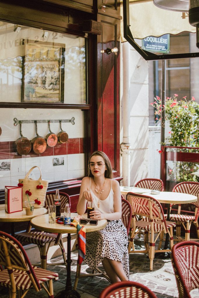 Zara polka dot skirt, white cami top, gucci ace heart sneakers, cherry pom pom straw summer bag, paris, andreea birsan, couturezilla, cute summer outfit ideas 2018, polka dot midi skirt, spaghetti straps white camisole top, mango white, white and black midi skirt, the zara sold out polka dot skirt, basic white cami top, how to wear a midi skirt, what to wear with a midi polka dot skirt, how to style a polka dot skirt, how to wear a polka dot skirt, gucci trainers, gucci ace heart embroidered sneakers, white trainers, heart embroidery, white leather shoes, parisian cafe, skirt and sneakers, shell accessories, shell necklaces, gold layered necklaces, gucci inspired embellished square sunglasses, 90s sunglasses, black sunglasses, printed silk scarf, clear lens aviator glasses, zara glasses, the geeky glasses trend, the clear lens glasses trend you’ve seen on instagram, popular glasses, gucci 90s inspired square embellished sunglasses with rhinestones, pom pom summer bag, straw bag, asos sold out summer bag, raffia tote bag, statement summer bag, how to look Parisian chic, European summer street style inspiration for women 2017, pinterest chic outfit ideas for woman, summer outfit ideas, summer ootd inspiration, outfit of the day, ootd, fashion icon, style inspiration, fashionista, fashion inspiration, style inspo, what to wear in summer, how to look French, chic on a budget, zara outfit, mango, topshop, asos, river island, forever 21, urban outfitters, how to mix high end pieces with luxury ones, zara and Gucci,outfit alternatives for summer, tomboy chic, minimal outfit, tumblr girls photos, pictures, happy girl, women, smart casual outfits, the best outfit ideas 2017, what to wear when you don’t feel inspired, summer in Europe, weekend attire, uniform, French women in summer, European outfit ideas 2017, minimal chic outfit, how to stand out, the best outfit ideas for summer, the sunglasses you have seen everywhere on Instagram, glasses, uk fashion blogger, united kingdom, uk fashion blog, fashion and travel blog, Europe, women with style, street style, summer fashion trends 2017, best fashion ideas, styling, fall fashion, fall outfit, fall ootd, fall perfect, transitional dressing, best transitional outfit ideas, how to wear statement earrings, dressing for autumn, autumn outfit, winter outfit ideas for work and school 2017