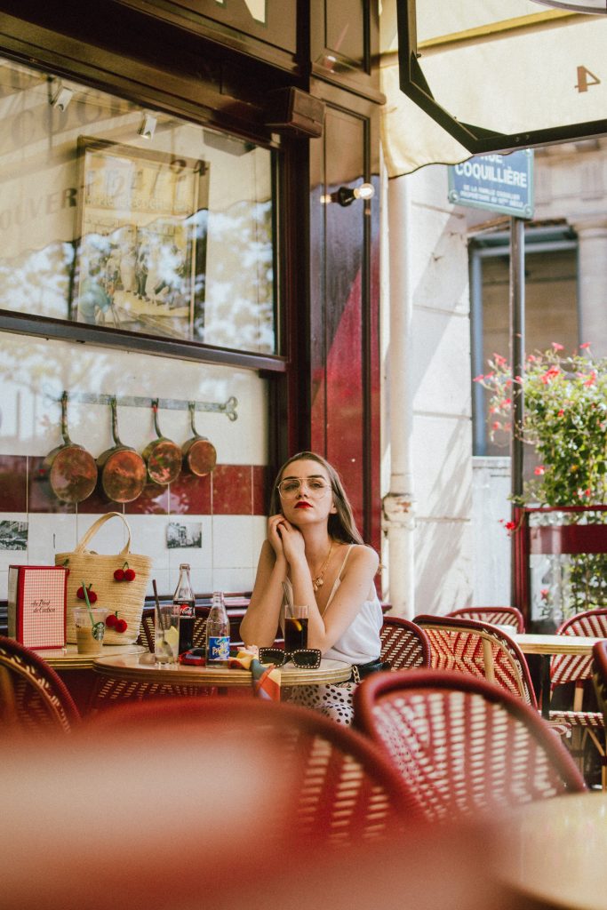 Zara polka dot skirt, white cami top, gucci ace heart sneakers, cherry pom pom straw summer bag, paris, andreea birsan, couturezilla, cute summer outfit ideas 2018, polka dot midi skirt, spaghetti straps white camisole top, mango white, white and black midi skirt, the zara sold out polka dot skirt, basic white cami top, how to wear a midi skirt, what to wear with a midi polka dot skirt, how to style a polka dot skirt, how to wear a polka dot skirt, gucci trainers, gucci ace heart embroidered sneakers, white trainers, heart embroidery, white leather shoes, parisian cafe, skirt and sneakers, shell accessories, shell necklaces, gold layered necklaces, gucci inspired embellished square sunglasses, 90s sunglasses, black sunglasses, printed silk scarf, clear lens aviator glasses, zara glasses, the geeky glasses trend, the clear lens glasses trend you’ve seen on instagram, popular glasses, gucci 90s inspired square embellished sunglasses with rhinestones, pom pom summer bag, straw bag, asos sold out summer bag, raffia tote bag, statement summer bag, how to look Parisian chic, European summer street style inspiration for women 2017, pinterest chic outfit ideas for woman, summer outfit ideas, summer ootd inspiration, outfit of the day, ootd, fashion icon, style inspiration, fashionista, fashion inspiration, style inspo, what to wear in summer, how to look French, chic on a budget, zara outfit, mango, topshop, asos, river island, forever 21, urban outfitters, how to mix high end pieces with luxury ones, zara and Gucci,outfit alternatives for summer, tomboy chic, minimal outfit, tumblr girls photos, pictures, happy girl, women, smart casual outfits, the best outfit ideas 2017, what to wear when you don’t feel inspired, summer in Europe, weekend attire, uniform, French women in summer, European outfit ideas 2017, minimal chic outfit, how to stand out, the best outfit ideas for summer, the sunglasses you have seen everywhere on Instagram, glasses, uk fashion blogger, united kingdom, uk fashion blog, fashion and travel blog, Europe, women with style, street style, summer fashion trends 2017, best fashion ideas, styling, fall fashion, fall outfit, fall ootd, fall perfect, transitional dressing, best transitional outfit ideas, how to wear statement earrings, dressing for autumn, autumn outfit, winter outfit ideas for work and school 2017