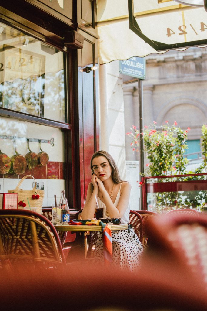 Zara polka dot skirt, white cami top, gucci ace heart sneakers, cherry pom pom straw summer bag, paris, andreea birsan, couturezilla, cute summer outfit ideas 2018, polka dot midi skirt, spaghetti straps white camisole top, mango white, white and black midi skirt, the zara sold out polka dot skirt, basic white cami top, how to wear a midi skirt, what to wear with a midi polka dot skirt, how to style a polka dot skirt, how to wear a polka dot skirt, gucci trainers, gucci ace heart embroidered sneakers, white trainers, heart embroidery, white leather shoes, parisian cafe, skirt and sneakers, shell accessories, shell necklaces, gold layered necklaces, gucci inspired embellished square sunglasses, 90s sunglasses, black sunglasses, printed silk scarf, clear lens aviator glasses, zara glasses, the geeky glasses trend, the clear lens glasses trend you’ve seen on instagram, popular glasses, gucci 90s inspired square embellished sunglasses with rhinestones, pom pom summer bag, straw bag, asos sold out summer bag, raffia tote bag, statement summer bag, how to look Parisian chic, European summer street style inspiration for women 2017, pinterest chic outfit ideas for woman, summer outfit ideas, summer ootd inspiration, outfit of the day, ootd, fashion icon, style inspiration, fashionista, fashion inspiration, style inspo, what to wear in summer, how to look French, chic on a budget, zara outfit, mango, topshop, asos, river island, forever 21, urban outfitters, how to mix high end pieces with luxury ones, zara and Gucci,outfit alternatives for summer, tomboy chic, minimal outfit, tumblr girls photos, pictures, happy girl, women, smart casual outfits, the best outfit ideas 2017, what to wear when you don’t feel inspired, summer in Europe, weekend attire, uniform, French women in summer, European outfit ideas 2017, minimal chic outfit, how to stand out, the best outfit ideas for summer, the sunglasses you have seen everywhere on Instagram, glasses, uk fashion blogger, united kingdom, uk fashion blog, fashion and travel blog, Europe, women with style, street style, summer fashion trends 2017, best fashion ideas, styling, fall fashion, fall outfit, fall ootd, fall perfect, transitional dressing, best transitional outfit ideas, how to wear statement earrings, dressing for autumn, autumn outfit, winter outfit ideas for work and school 2017