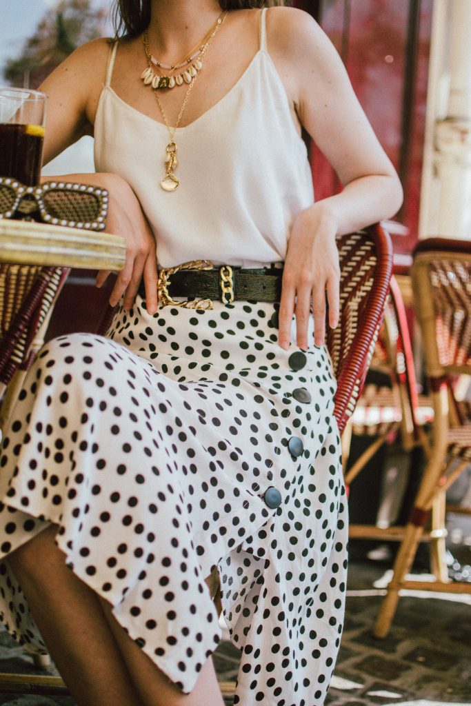 Zara polka dot skirt, white cami top, gucci ace heart sneakers, cherry pom pom straw summer bag, paris, andreea birsan, couturezilla, cute summer outfit ideas 2018, polka dot midi skirt, spaghetti straps white camisole top, mango white, white and black midi skirt, the zara sold out polka dot skirt, basic white cami top, how to wear a midi skirt, what to wear with a midi polka dot skirt, how to style a polka dot skirt, how to wear a polka dot skirt, gucci trainers, gucci ace heart embroidered sneakers, white trainers, heart embroidery, white leather shoes, parisian cafe, skirt and sneakers, shell accessories, shell necklaces, gold layered necklaces, gucci inspired embellished square sunglasses, 90s sunglasses, black sunglasses, printed silk scarf, clear lens aviator glasses, zara glasses, the geeky glasses trend, the clear lens glasses trend you’ve seen on instagram, popular glasses, gucci 90s inspired square embellished sunglasses with rhinestones, pom pom summer bag, straw bag, asos sold out summer bag, raffia tote bag, statement summer bag, how to look Parisian chic, European summer street style inspiration for women 2017, pinterest chic outfit ideas for woman, summer outfit ideas, summer ootd inspiration, outfit of the day, ootd, fashion icon, style inspiration, fashionista, fashion inspiration, style inspo, what to wear in summer, how to look French, chic on a budget, zara outfit, mango, topshop, asos, river island, forever 21, urban outfitters, how to mix high end pieces with luxury ones, zara and Gucci,outfit alternatives for summer, tomboy chic, minimal outfit, tumblr girls photos, pictures, happy girl, women, smart casual outfits, the best outfit ideas 2017, what to wear when you don’t feel inspired, summer in Europe, weekend attire, uniform, French women in summer, European outfit ideas 2017, minimal chic outfit, how to stand out, the best outfit ideas for summer, the sunglasses you have seen everywhere on Instagram, glasses, uk fashion blogger, united kingdom, uk fashion blog, fashion and travel blog, Europe, women with style, street style, summer fashion trends 2017, best fashion ideas, styling, fall fashion, fall outfit, fall ootd, fall perfect, transitional dressing, best transitional outfit ideas, how to wear statement earrings, dressing for autumn, autumn outfit, winter outfit ideas for work and school 2017