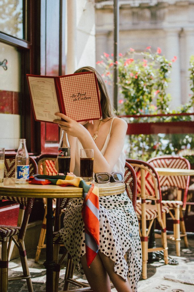 Zara polka dot skirt, white cami top, gucci ace heart sneakers, cherry pom pom straw summer bag, paris, andreea birsan, couturezilla, cute summer outfit ideas 2018, polka dot midi skirt, spaghetti straps white camisole top, mango white, white and black midi skirt, the zara sold out polka dot skirt, basic white cami top, how to wear a midi skirt, what to wear with a midi polka dot skirt, how to style a polka dot skirt, how to wear a polka dot skirt, gucci trainers, gucci ace heart embroidered sneakers, white trainers, heart embroidery, white leather shoes, parisian cafe, skirt and sneakers, shell accessories, shell necklaces, gold layered necklaces, gucci inspired embellished square sunglasses, 90s sunglasses, black sunglasses, printed silk scarf, clear lens aviator glasses, zara glasses, the geeky glasses trend, the clear lens glasses trend you’ve seen on instagram, popular glasses, gucci 90s inspired square embellished sunglasses with rhinestones, pom pom summer bag, straw bag, asos sold out summer bag, raffia tote bag, statement summer bag, how to look Parisian chic, European summer street style inspiration for women 2017, pinterest chic outfit ideas for woman, summer outfit ideas, summer ootd inspiration, outfit of the day, ootd, fashion icon, style inspiration, fashionista, fashion inspiration, style inspo, what to wear in summer, how to look French, chic on a budget, zara outfit, mango, topshop, asos, river island, forever 21, urban outfitters, how to mix high end pieces with luxury ones, zara and Gucci,outfit alternatives for summer, tomboy chic, minimal outfit, tumblr girls photos, pictures, happy girl, women, smart casual outfits, the best outfit ideas 2017, what to wear when you don’t feel inspired, summer in Europe, weekend attire, uniform, French women in summer, European outfit ideas 2017, minimal chic outfit, how to stand out, the best outfit ideas for summer, the sunglasses you have seen everywhere on Instagram, glasses, uk fashion blogger, united kingdom, uk fashion blog, fashion and travel blog, Europe, women with style, street style, summer fashion trends 2017, best fashion ideas, styling, fall fashion, fall outfit, fall ootd, fall perfect, transitional dressing, best transitional outfit ideas, how to wear statement earrings, dressing for autumn, autumn outfit, winter outfit ideas for work and school 2017