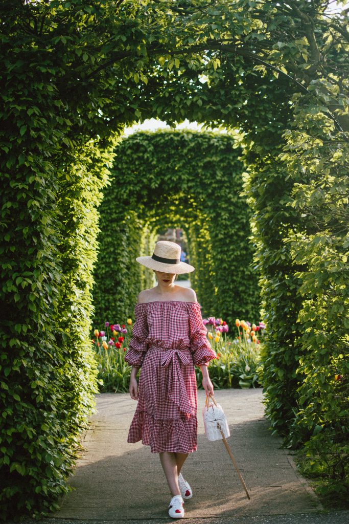 Keukenhof, red gingham dress, midi dress, gucci sneakers, straw bag, andreea birsan, couturezilla, cute summer outfit ideas 2018, when to visit the tulip fields in the netherlands, the best time to visit the dutch tulip fields, the keukenhof gardens, plan a trip to the netherlands, holland, dutch tulips, dutch tulip garden near amsterdam, the most beautiful park in europe, where to find the most beautiful flowers for photos, instagram worthy spots in holland, the popular tulip fields from instagram, the best time for visiting the popular tulip fields you keep seeing on instagram, zara sold out midi gingham dress, h&m straw boater hat, flower fields, white dress, straw bag, the white wicker bag from mango, mango white straw box bag, box bag, handmade bamboo bag, the best summer bags, handmade bags, soap bubbles, keukenhof park, keukenhof gardens, the price for a ticket at keukenhof, how’s the weather at keukenhof, lisse, the netherlands, hollidays in the netherlands, gucci ace heart embroidered sneakers, white leather trainers, white gucci shoes, gucci white shoes with hearts, gucci ace sneakers, the best gucci sneakers, how to look Parisian chic, European summer street style inspiration for women 2017, pinterest chic outfit ideas for woman, summer outfit ideas, summer ootd inspiration, outfit of the day, ootd, fashion icon, style inspiration, fashionista, fashion inspiration, style inspo, what to wear in summer, how to look French, chic on a budget, zara outfit, mango, topshop, asos, river island, forever 21, urban outfitters, how to mix high end pieces with luxury ones, zara and Gucci,outfit alternatives for summer, tomboy chic, minimal outfit, tumblr girls photos, pictures, happy girl, women, smart casual outfits, the best outfit ideas 2017, what to wear when you don’t feel inspired, summer in Europe, weekend attire, uniform, French women in summer, European outfit ideas 2017, minimal chic outfit, how to stand out, the best outfit ideas for summer, the sunglasses you have seen everywhere on Instagram, glasses, uk fashion blogger, united kingdom, uk fashion blog, fashion and travel blog, Europe, women with style, street style, summer fashion trends 2017, best fashion ideas, styling, fall fashion, fall outfit, fall ootd, fall perfect, transitional dressing, best transitional outfit ideas, how to wear statement earrings, dressing for autumn, autumn outfit, winter outfit ideas for work and school 2017