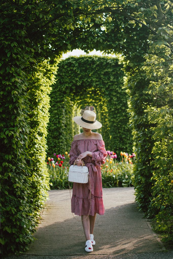 Keukenhof, red gingham dress, midi dress, gucci sneakers, straw bag, andreea birsan, couturezilla, cute summer outfit ideas 2018, when to visit the tulip fields in the netherlands, the best time to visit the dutch tulip fields, the keukenhof gardens, plan a trip to the netherlands, holland, dutch tulips, dutch tulip garden near amsterdam, the most beautiful park in europe, where to find the most beautiful flowers for photos, instagram worthy spots in holland, the popular tulip fields from instagram, the best time for visiting the popular tulip fields you keep seeing on instagram, zara sold out midi gingham dress, h&m straw boater hat, flower fields, white dress, straw bag, the white wicker bag from mango, mango white straw box bag, box bag, handmade bamboo bag, the best summer bags, handmade bags, soap bubbles, keukenhof park, keukenhof gardens, the price for a ticket at keukenhof, how’s the weather at keukenhof, lisse, the netherlands, hollidays in the netherlands, gucci ace heart embroidered sneakers, white leather trainers, white gucci shoes, gucci white shoes with hearts, gucci ace sneakers, the best gucci sneakers, how to look Parisian chic, European summer street style inspiration for women 2017, pinterest chic outfit ideas for woman, summer outfit ideas, summer ootd inspiration, outfit of the day, ootd, fashion icon, style inspiration, fashionista, fashion inspiration, style inspo, what to wear in summer, how to look French, chic on a budget, zara outfit, mango, topshop, asos, river island, forever 21, urban outfitters, how to mix high end pieces with luxury ones, zara and Gucci,outfit alternatives for summer, tomboy chic, minimal outfit, tumblr girls photos, pictures, happy girl, women, smart casual outfits, the best outfit ideas 2017, what to wear when you don’t feel inspired, summer in Europe, weekend attire, uniform, French women in summer, European outfit ideas 2017, minimal chic outfit, how to stand out, the best outfit ideas for summer, the sunglasses you have seen everywhere on Instagram, glasses, uk fashion blogger, united kingdom, uk fashion blog, fashion and travel blog, Europe, women with style, street style, summer fashion trends 2017, best fashion ideas, styling, fall fashion, fall outfit, fall ootd, fall perfect, transitional dressing, best transitional outfit ideas, how to wear statement earrings, dressing for autumn, autumn outfit, winter outfit ideas for work and school 2017