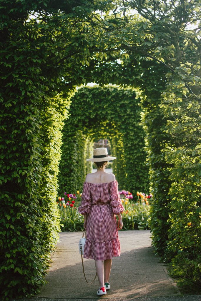 Keukenhof, red gingham dress, midi dress, gucci sneakers, straw bag, andreea birsan, couturezilla, cute summer outfit ideas 2018, when to visit the tulip fields in the netherlands, the best time to visit the dutch tulip fields, the keukenhof gardens, plan a trip to the netherlands, holland, dutch tulips, dutch tulip garden near amsterdam, the most beautiful park in europe, where to find the most beautiful flowers for photos, instagram worthy spots in holland, the popular tulip fields from instagram, the best time for visiting the popular tulip fields you keep seeing on instagram, zara sold out midi gingham dress, h&m straw boater hat, flower fields, white dress, straw bag, the white wicker bag from mango, mango white straw box bag, box bag, handmade bamboo bag, the best summer bags, handmade bags, soap bubbles, keukenhof park, keukenhof gardens, the price for a ticket at keukenhof, how’s the weather at keukenhof, lisse, the netherlands, hollidays in the netherlands, gucci ace heart embroidered sneakers, white leather trainers, white gucci shoes, gucci white shoes with hearts, gucci ace sneakers, the best gucci sneakers, how to look Parisian chic, European summer street style inspiration for women 2017, pinterest chic outfit ideas for woman, summer outfit ideas, summer ootd inspiration, outfit of the day, ootd, fashion icon, style inspiration, fashionista, fashion inspiration, style inspo, what to wear in summer, how to look French, chic on a budget, zara outfit, mango, topshop, asos, river island, forever 21, urban outfitters, how to mix high end pieces with luxury ones, zara and Gucci,outfit alternatives for summer, tomboy chic, minimal outfit, tumblr girls photos, pictures, happy girl, women, smart casual outfits, the best outfit ideas 2017, what to wear when you don’t feel inspired, summer in Europe, weekend attire, uniform, French women in summer, European outfit ideas 2017, minimal chic outfit, how to stand out, the best outfit ideas for summer, the sunglasses you have seen everywhere on Instagram, glasses, uk fashion blogger, united kingdom, uk fashion blog, fashion and travel blog, Europe, women with style, street style, summer fashion trends 2017, best fashion ideas, styling, fall fashion, fall outfit, fall ootd, fall perfect, transitional dressing, best transitional outfit ideas, how to wear statement earrings, dressing for autumn, autumn outfit, winter outfit ideas for work and school 2017