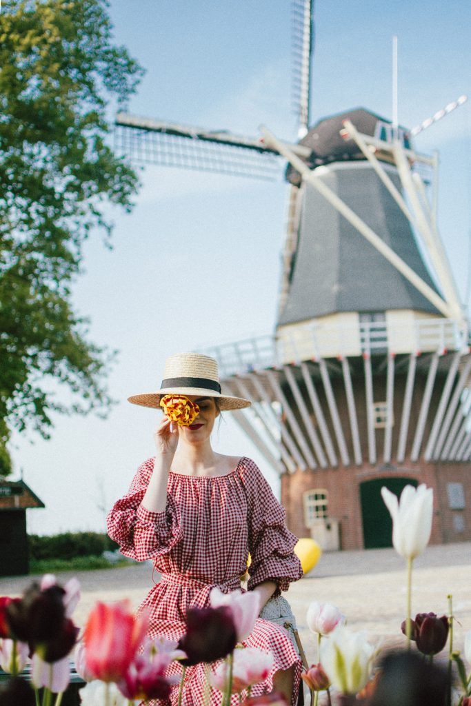 Keukenhof, red gingham dress, midi dress, gucci sneakers, straw bag, andreea birsan, couturezilla, cute summer outfit ideas 2018, when to visit the tulip fields in the netherlands, the best time to visit the dutch tulip fields, the keukenhof gardens, plan a trip to the netherlands, holland, dutch tulips, dutch tulip garden near amsterdam, the most beautiful park in europe, where to find the most beautiful flowers for photos, instagram worthy spots in holland, the popular tulip fields from instagram, the best time for visiting the popular tulip fields you keep seeing on instagram, zara sold out midi gingham dress, h&m straw boater hat, flower fields, white dress, straw bag, the white wicker bag from mango, mango white straw box bag, box bag, handmade bamboo bag, the best summer bags, handmade bags, soap bubbles, keukenhof park, keukenhof gardens, the price for a ticket at keukenhof, how’s the weather at keukenhof, lisse, the netherlands, hollidays in the netherlands, gucci ace heart embroidered sneakers, white leather trainers, white gucci shoes, gucci white shoes with hearts, gucci ace sneakers, the best gucci sneakers, how to look Parisian chic, European summer street style inspiration for women 2017, pinterest chic outfit ideas for woman, summer outfit ideas, summer ootd inspiration, outfit of the day, ootd, fashion icon, style inspiration, fashionista, fashion inspiration, style inspo, what to wear in summer, how to look French, chic on a budget, zara outfit, mango, topshop, asos, river island, forever 21, urban outfitters, how to mix high end pieces with luxury ones, zara and Gucci,outfit alternatives for summer, tomboy chic, minimal outfit, tumblr girls photos, pictures, happy girl, women, smart casual outfits, the best outfit ideas 2017, what to wear when you don’t feel inspired, summer in Europe, weekend attire, uniform, French women in summer, European outfit ideas 2017, minimal chic outfit, how to stand out, the best outfit ideas for summer, the sunglasses you have seen everywhere on Instagram, glasses, uk fashion blogger, united kingdom, uk fashion blog, fashion and travel blog, Europe, women with style, street style, summer fashion trends 2017, best fashion ideas, styling, fall fashion, fall outfit, fall ootd, fall perfect, transitional dressing, best transitional outfit ideas, how to wear statement earrings, dressing for autumn, autumn outfit, winter outfit ideas for work and school 2017